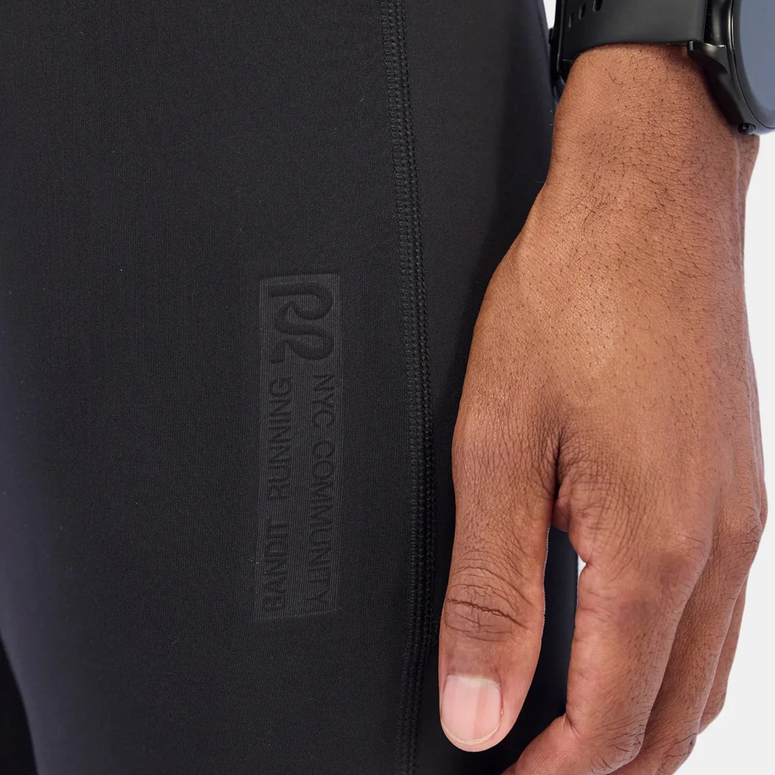 Bandit Brushed Stamina tights black front closeup showing elevated embossed branding detail on front thigh