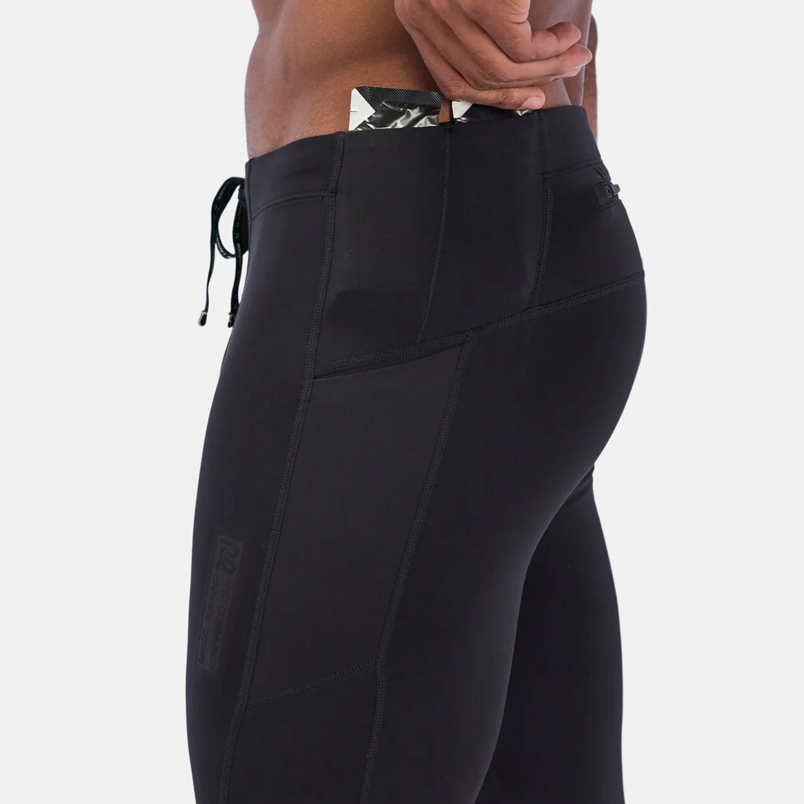 Bandit men's cold weather tights black side view featuring gel pocket for nutrition storage during long winter training runs