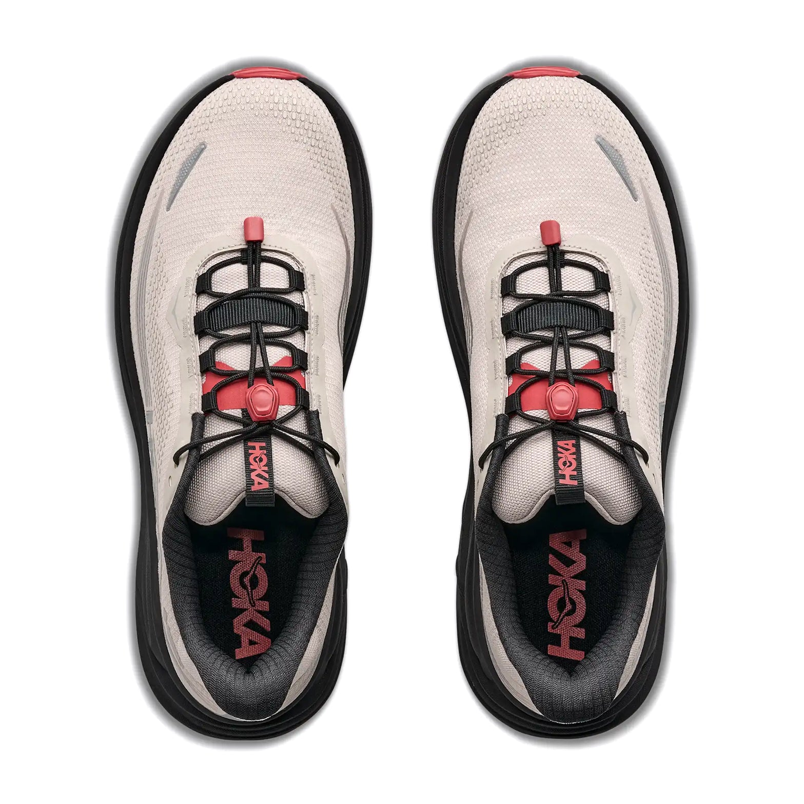 A pair of Hoka Men’s Clifton 11 GORE-TEX Running Shoes in River Rock Grey and Carbon Black, with black soles, black and red laces, and Hoka branding on the insoles, viewed from above. These waterproof running shoes offer ultra-smooth cushioning for a comfortable ride in any weather.