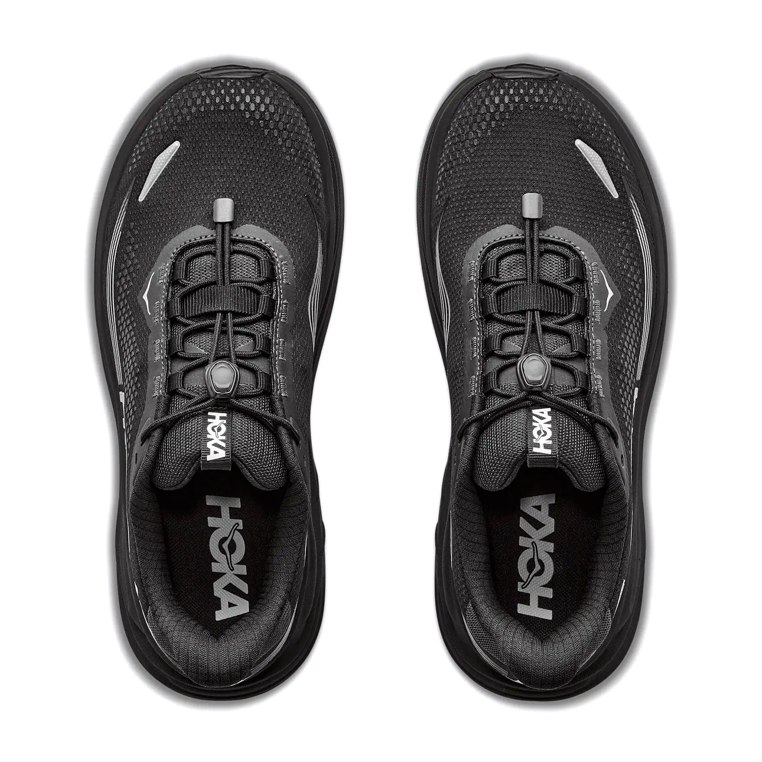 A pair of black Hoka Men’s Clifton 11 GORE-TEX Wide Fit Running Shoes are shown from above, highlighting the Hoka branding on the insoles and their distinctive toggle lacing system.