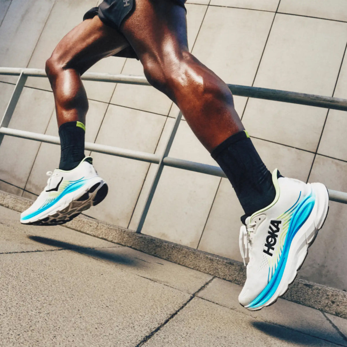 Men's HOKA Clifton 11 Running Shoes side view on runner showing compression moulded EVA cushioning with MetaRocker transitions and engineered mesh upper for comfortable everyday training