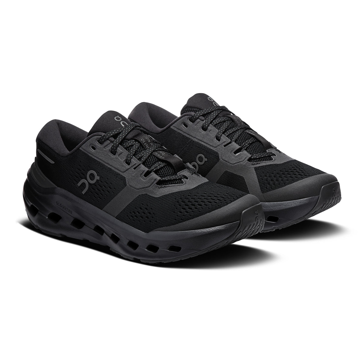 A pair of black athletic running shoes with mesh uppers, thick soles, and lace-up closures, displayed on a white background.