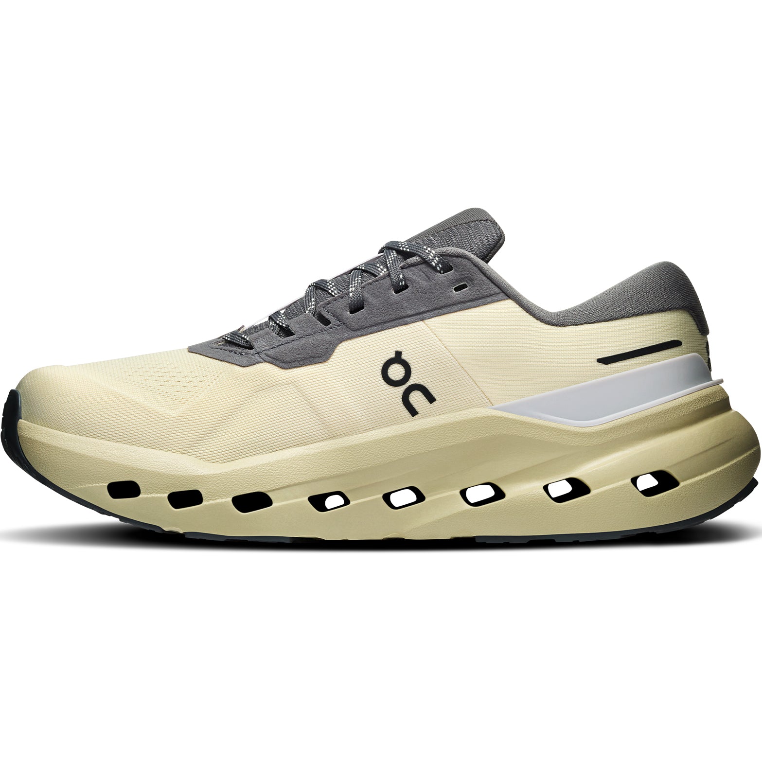 The On Men’s Cloudrunner 3 WP Running Shoes in Pollen / Haze are beige and gray athletic running shoes, featuring CloudTec stability in the thick sole with black ventilation holes and a black O logo on the side, shown from the left view.
