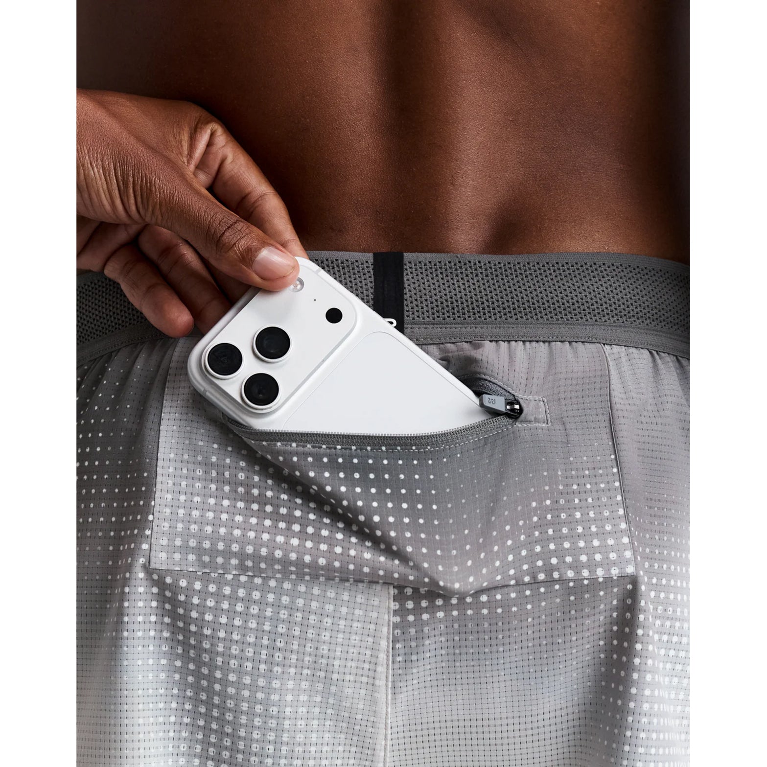 Men's Bandit CoolGrid 2-in-1 Run Short Micro Geo Gradient Slate Plaster close-up of zip pocket showing secure zippered storage with zero-bulk design for running essentials during training and racing