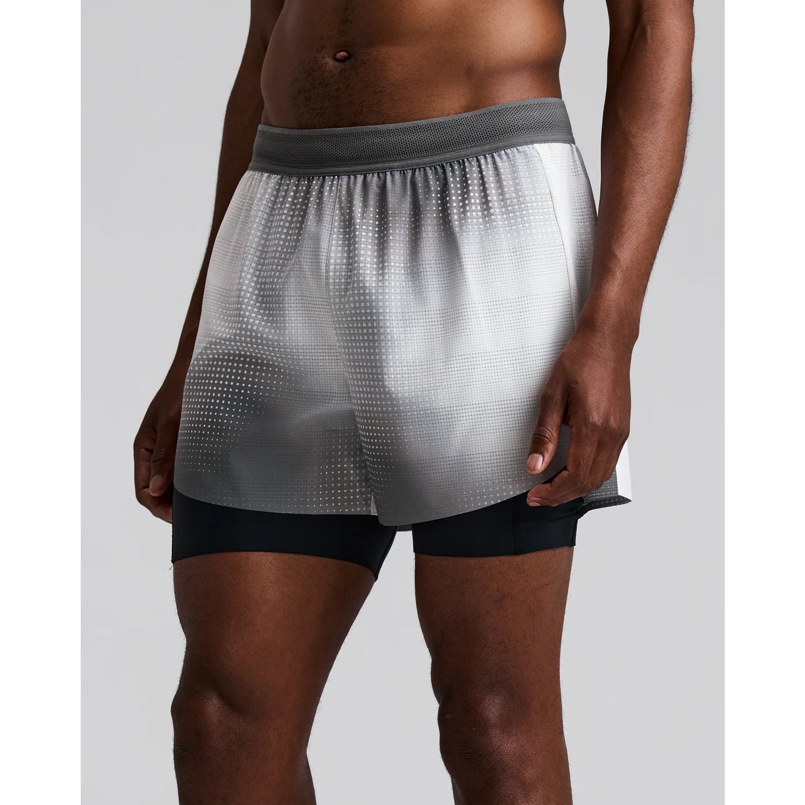Men's Bandit CoolGrid 2-in-1 Run Short Micro Geo Gradient Slate Plaster front view on male runner showing CoolGrid breathable outer with Micro Geo Gradient design, mesh waistband and waterproof leg phone pockets