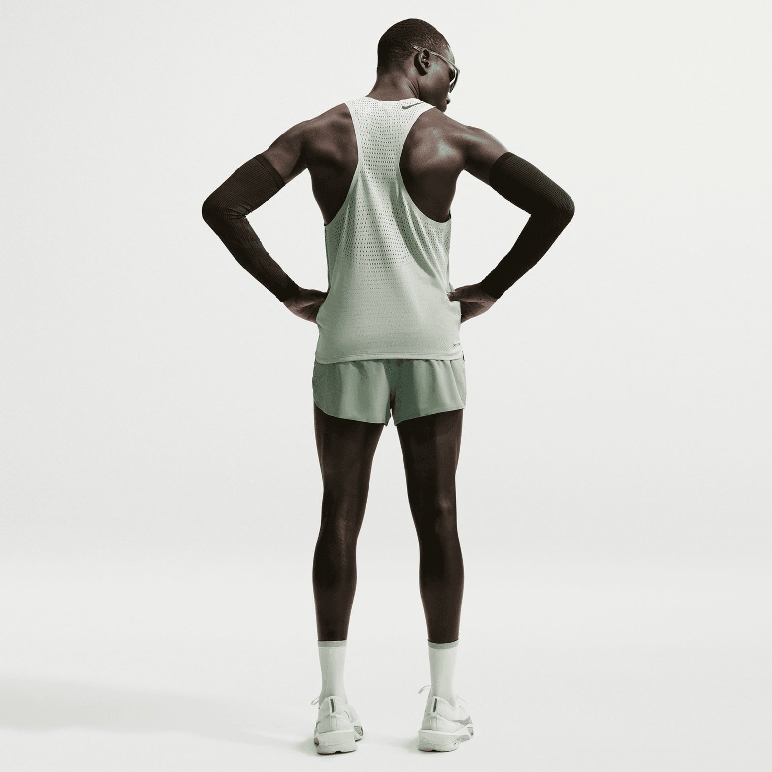 Men's Nike Dri-FIT AeroSwift ADV 2 Inch Running Shorts Steam Black back full body view on male runner showing 2-inch racing construction with updated side seam stitching for extra coverage