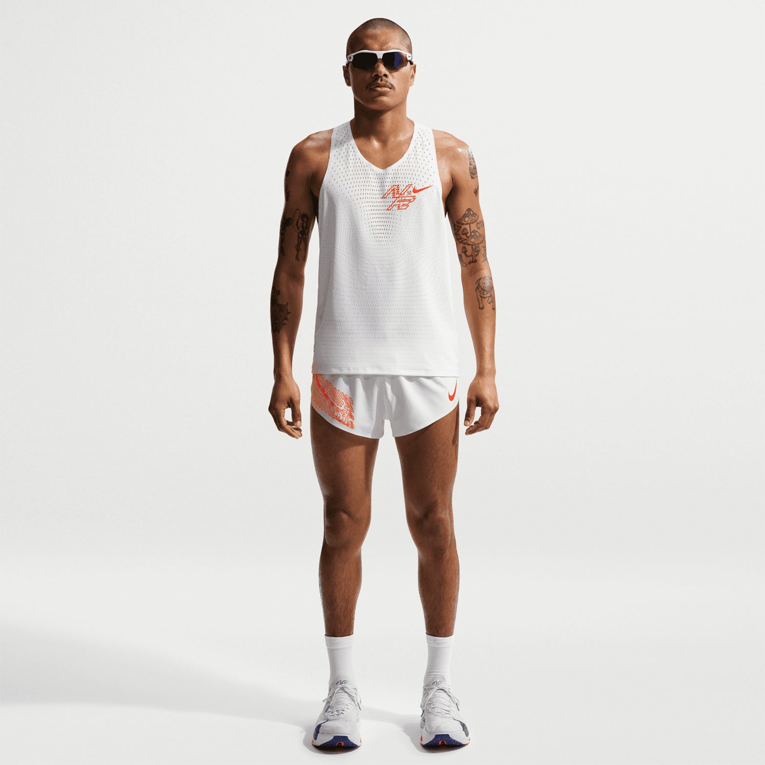 Nike Men's Dri-FIT AeroSwift ADV 2 inch shorts in Summit White — full body front view worn on model showing summit white 2 inch inseam, minimal race-focused design and four drop-in pocket placement with Flyvent waistband