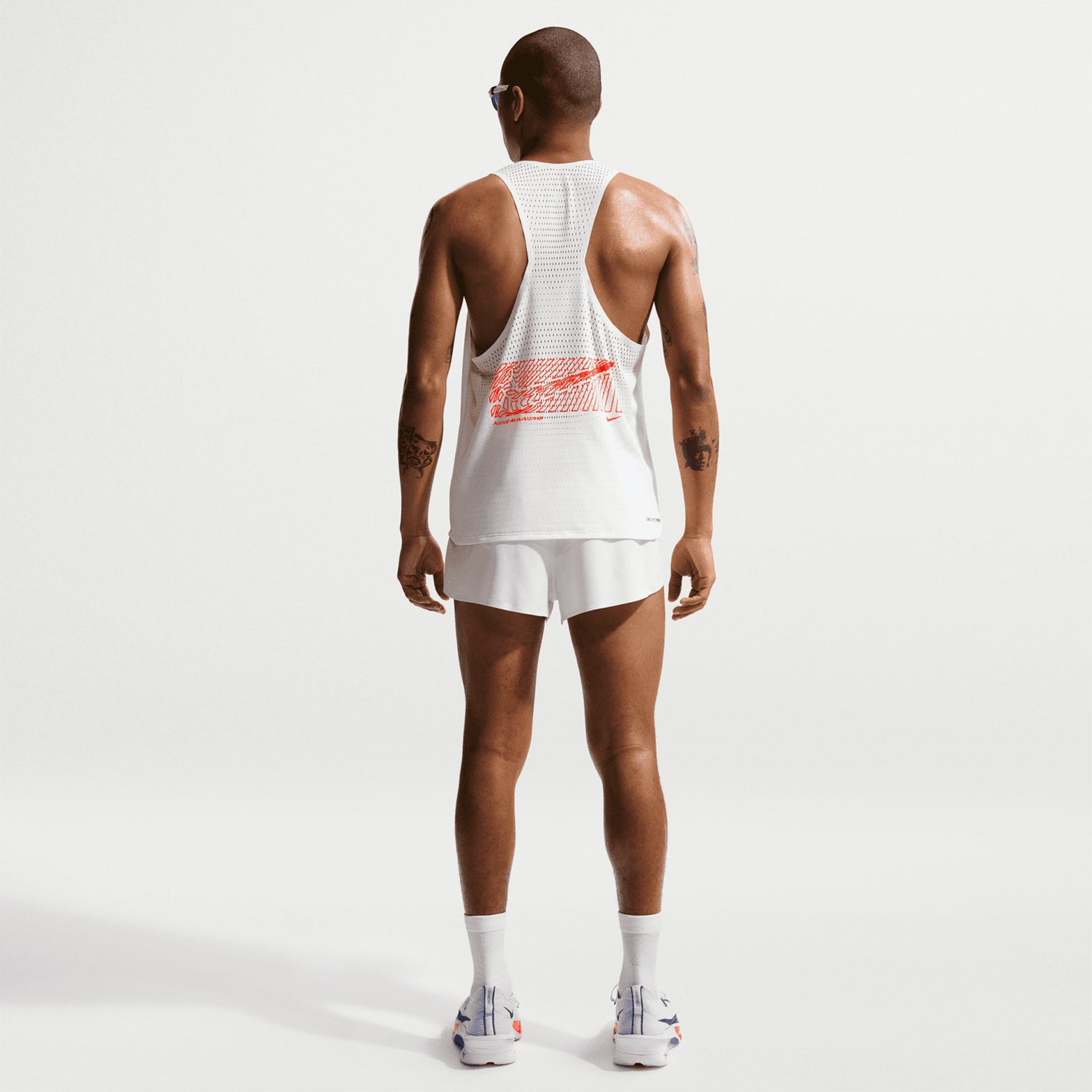 Nike Men's Dri-FIT AeroSwift ADV 2 inch shorts in Summit White — full body back view worn on model showing summit white four-way stretch woven construction, updated side seam stitching and zippered back pocket storage