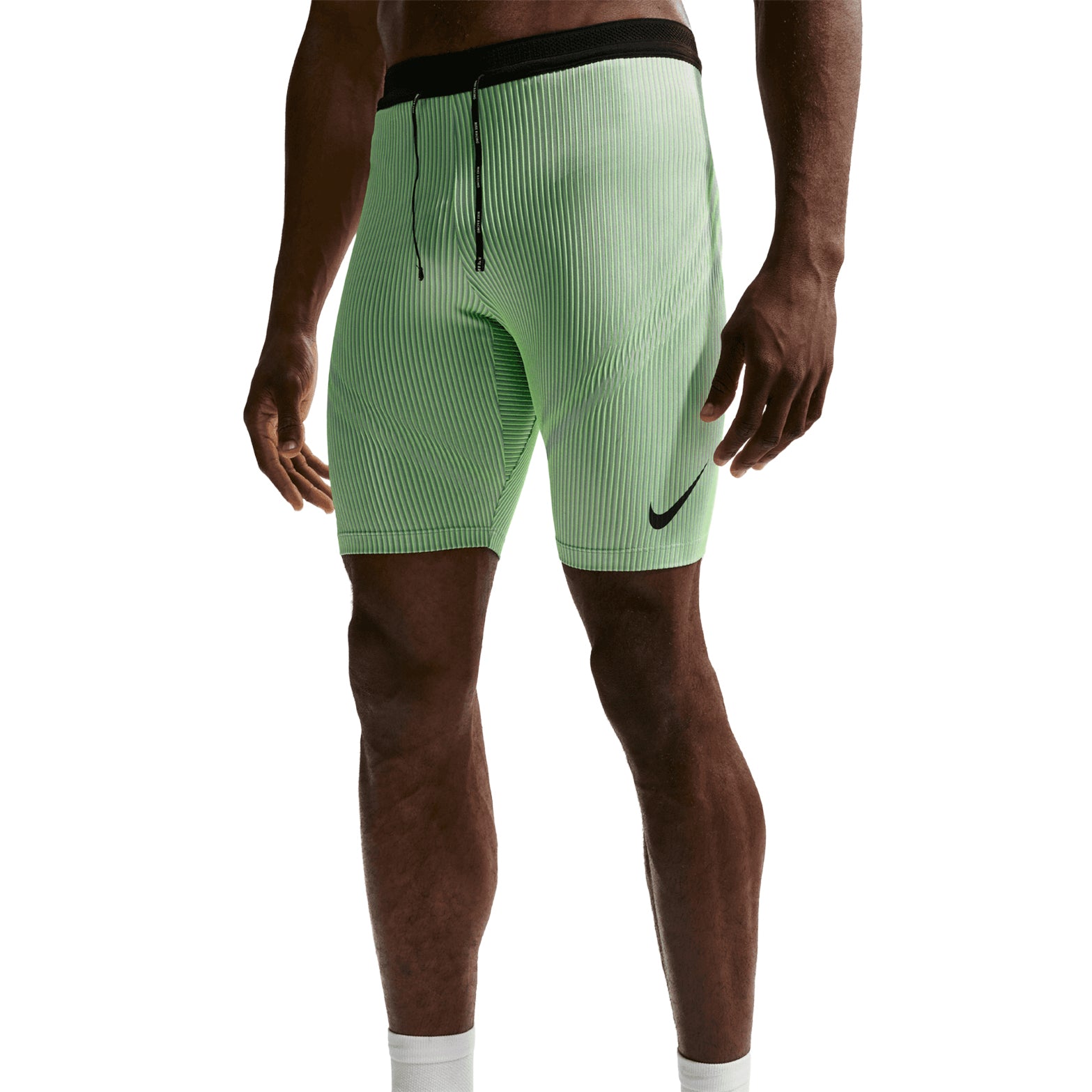 Men's Nike Dri-FIT AeroSwift ADV Half Tights Green close-up front showing stretch-woven ribbed fabric and Flyvent Waistband ventilation