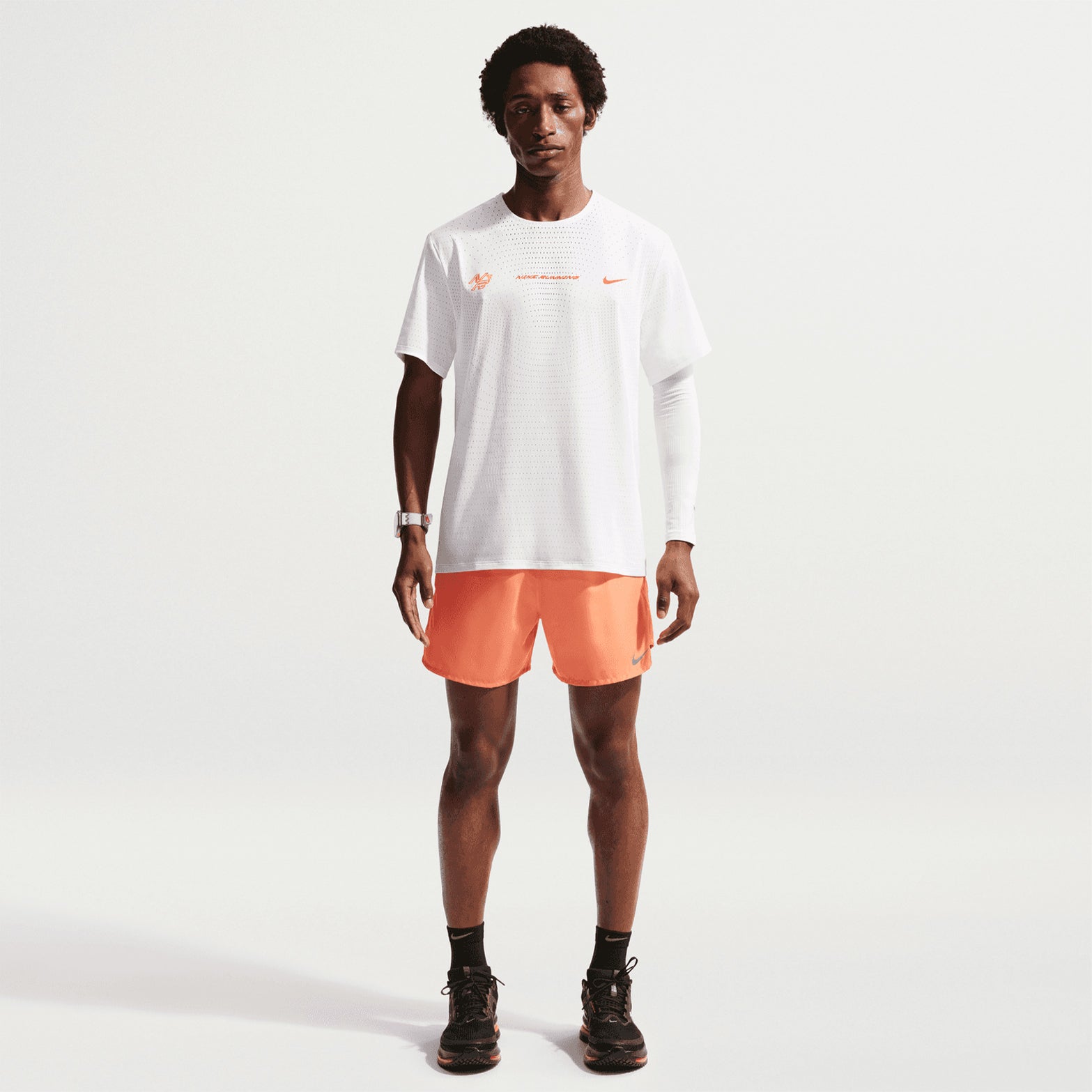 Nike AeroSwift men's Dri-FIT ADV running tee in Summit White — full body front view worn on model showing summit white Dri-FIT ADV moisture-wicking engineered knit and lightweight racing construction