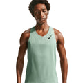 Men's Nike Dri-FIT AeroSwift ADV Running Vest Green close-up front showing data-driven ventilation holes and lightweight moisture-wicking fabric