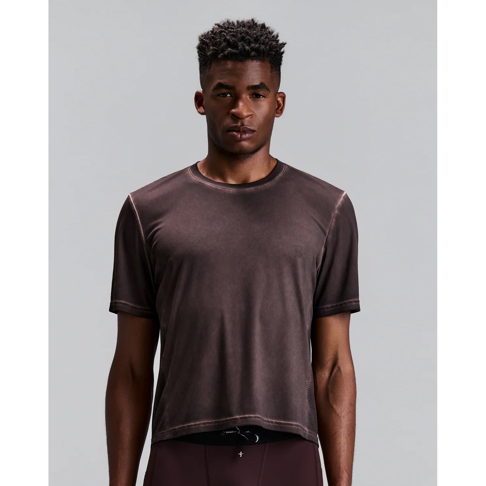 Men's Bandit FrioSoft Perforated Box Tee Espresso front view on male runner showing boxy fit with FrioSoft cool handfeel fabric and tonal branding for running and everyday wea
