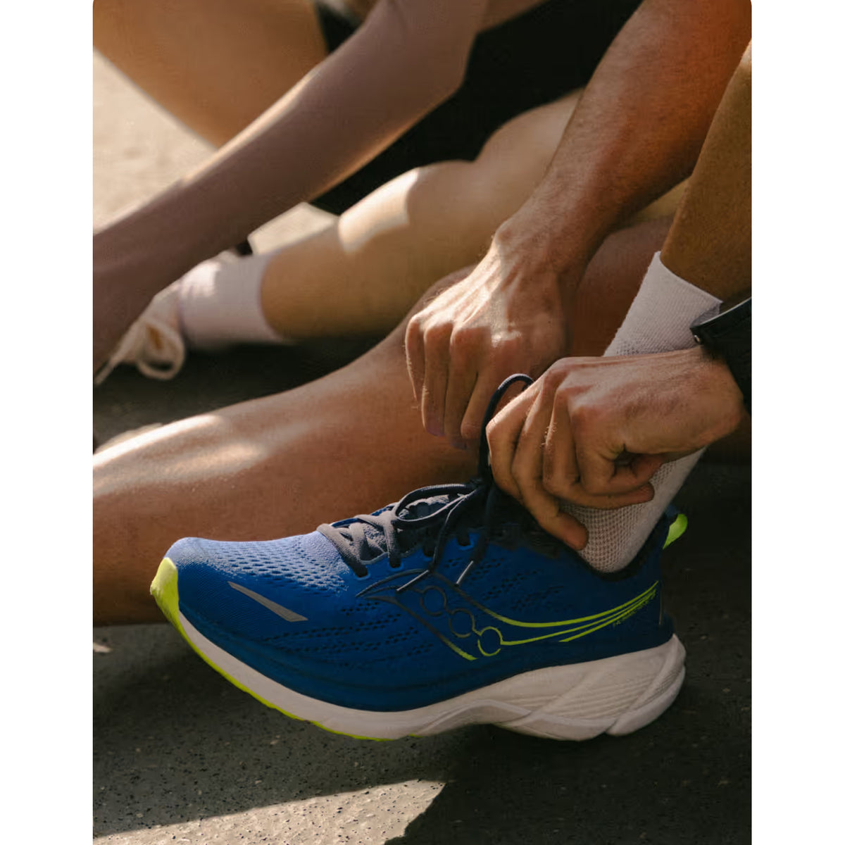 Men's Saucony Hurricane 25 Running Shoes worn by male runner showing fit and cushioned midsole profile 