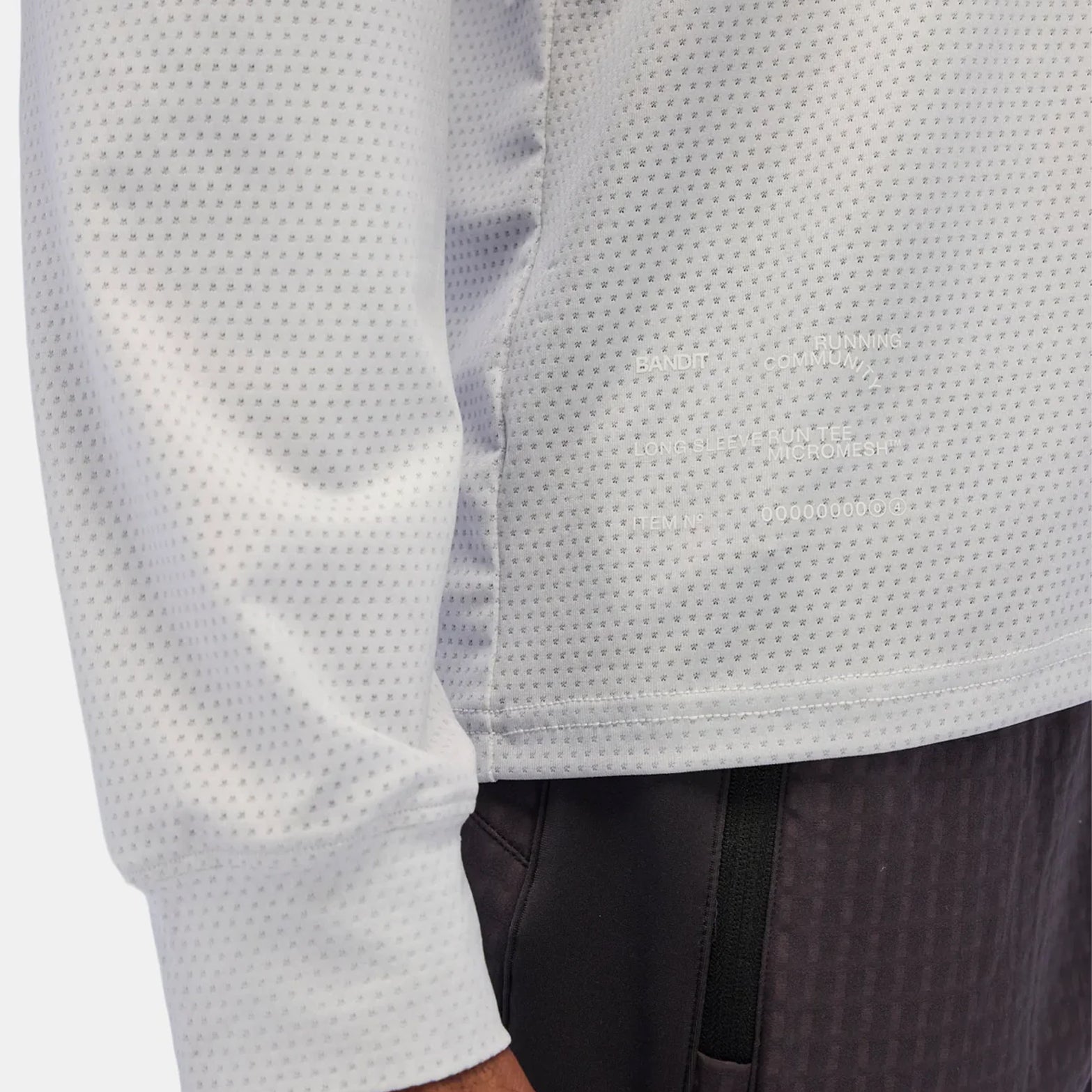 Bandit MicroMesh top Ash Gradient hem closeup featuring reflective infographic detail for low-light visibility