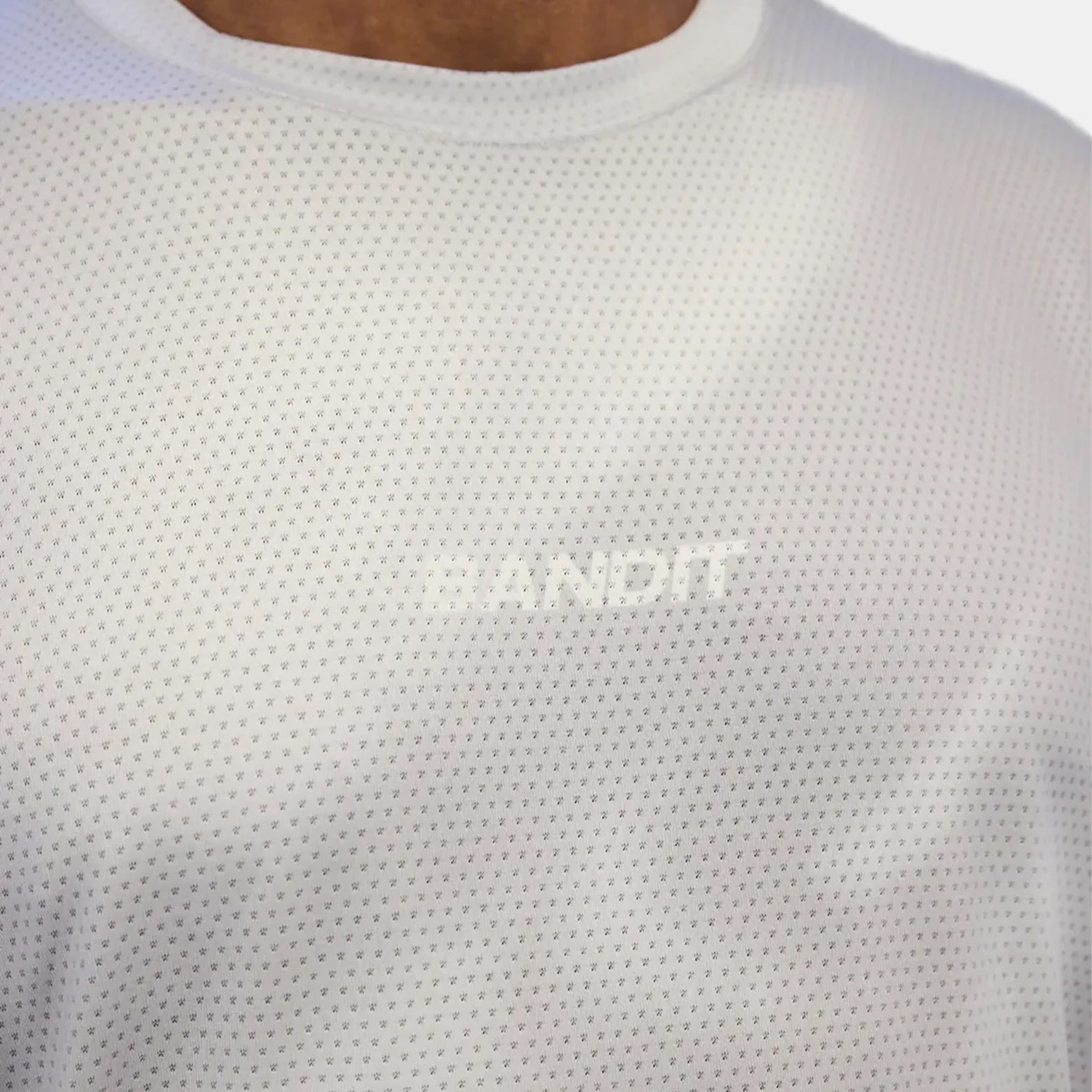 Bandit men's MicroMesh top Ash Gradient front closeup showing reflective logo detail and silky smooth mesh construction
