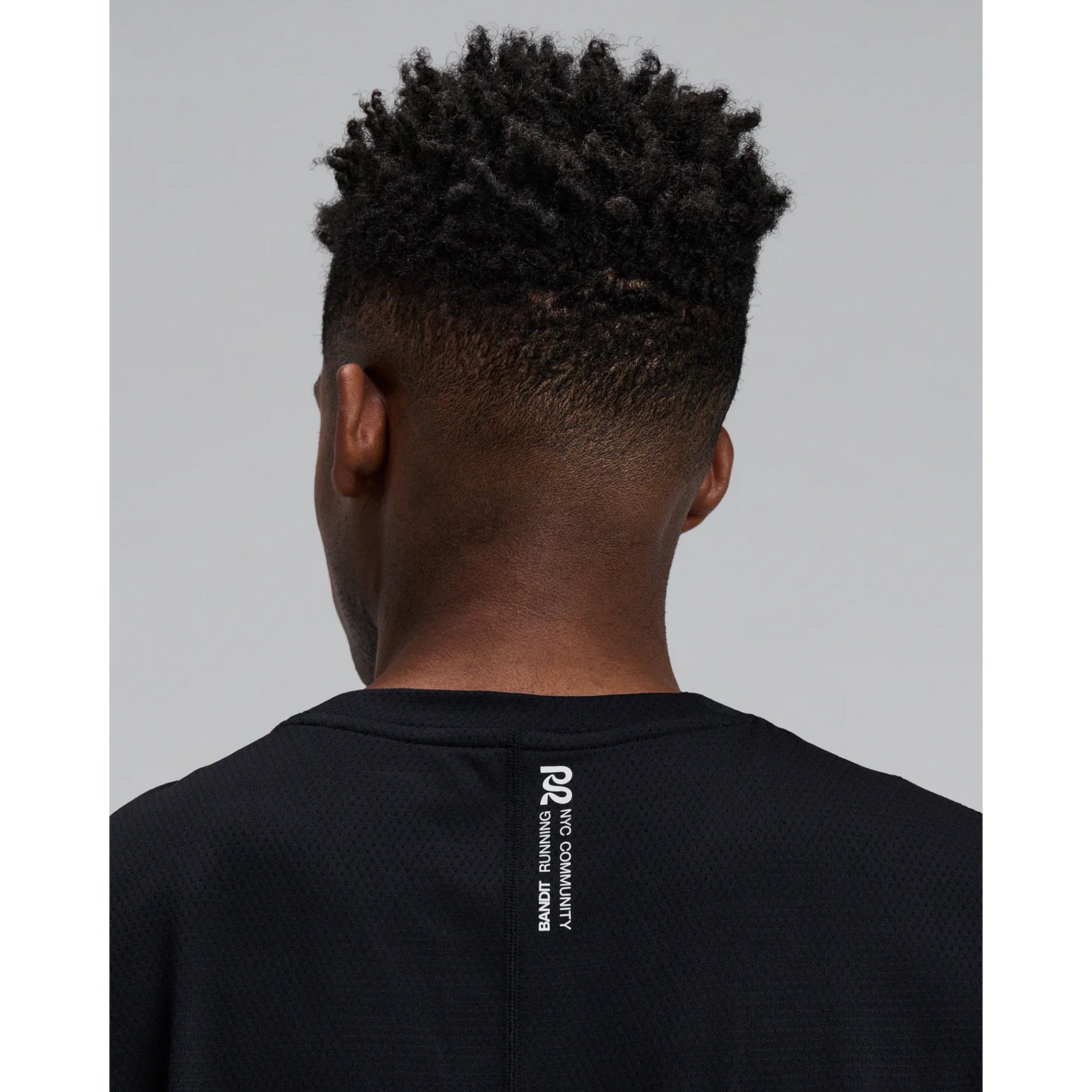 Men's Bandit Micromesh Run Tank Black close-up of back showing fast-drying Micromesh fabric with sweat-wicking airflow construction for sustained running efforts