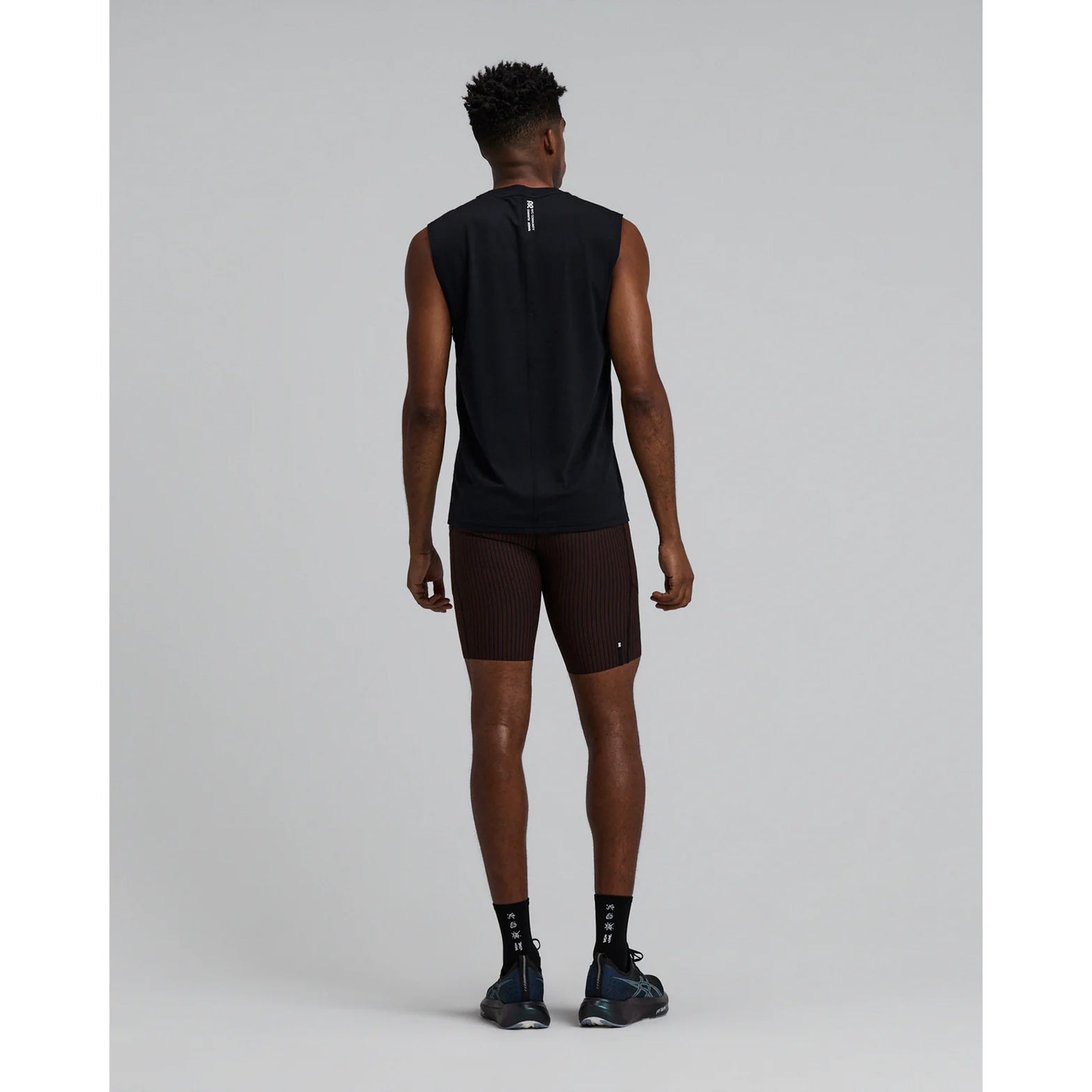 Men's Bandit Micromesh Run Tank Black back full body view on male runner showing relaxed tank construction with fast-drying Micromesh fabric for comfortable running and training
