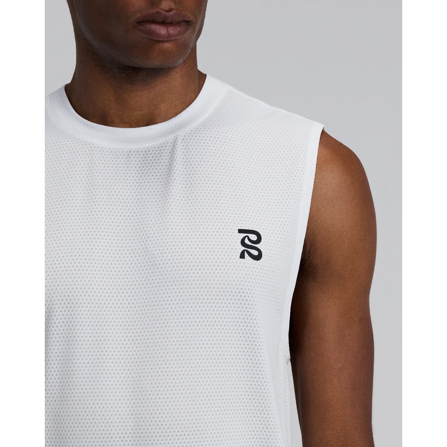 Men's Bandit Micromesh Run Tank White close-up of front showing subtle two-tone Bandit logo branding with ultra-breathable Micromesh fabric and Oeko-Tex certified BPA-free construction