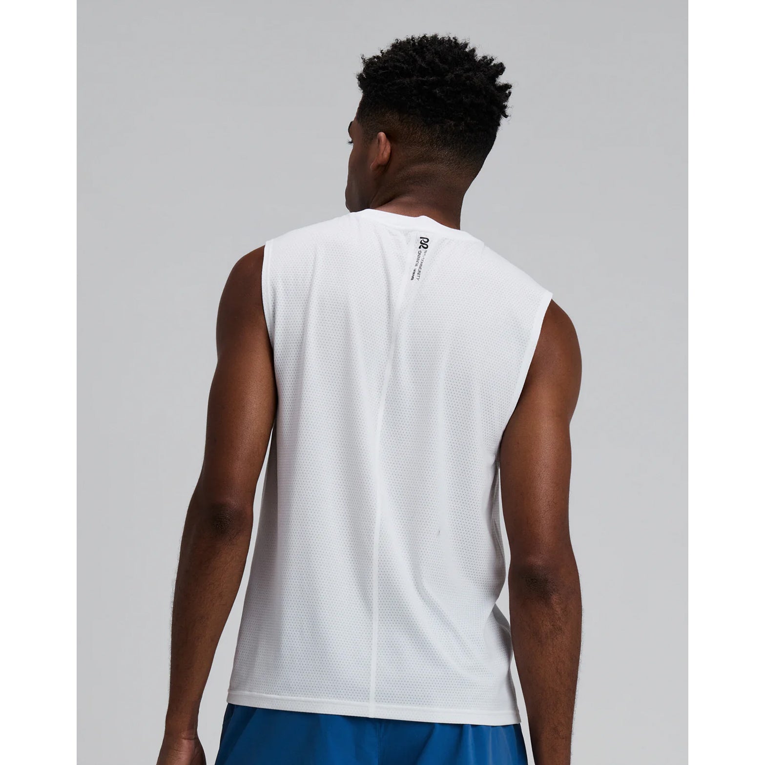 Men's Bandit Micromesh Run Tank White back view on male runner showing breathable Micromesh construction with fast-drying sweat-wicking fabric for comfortable running