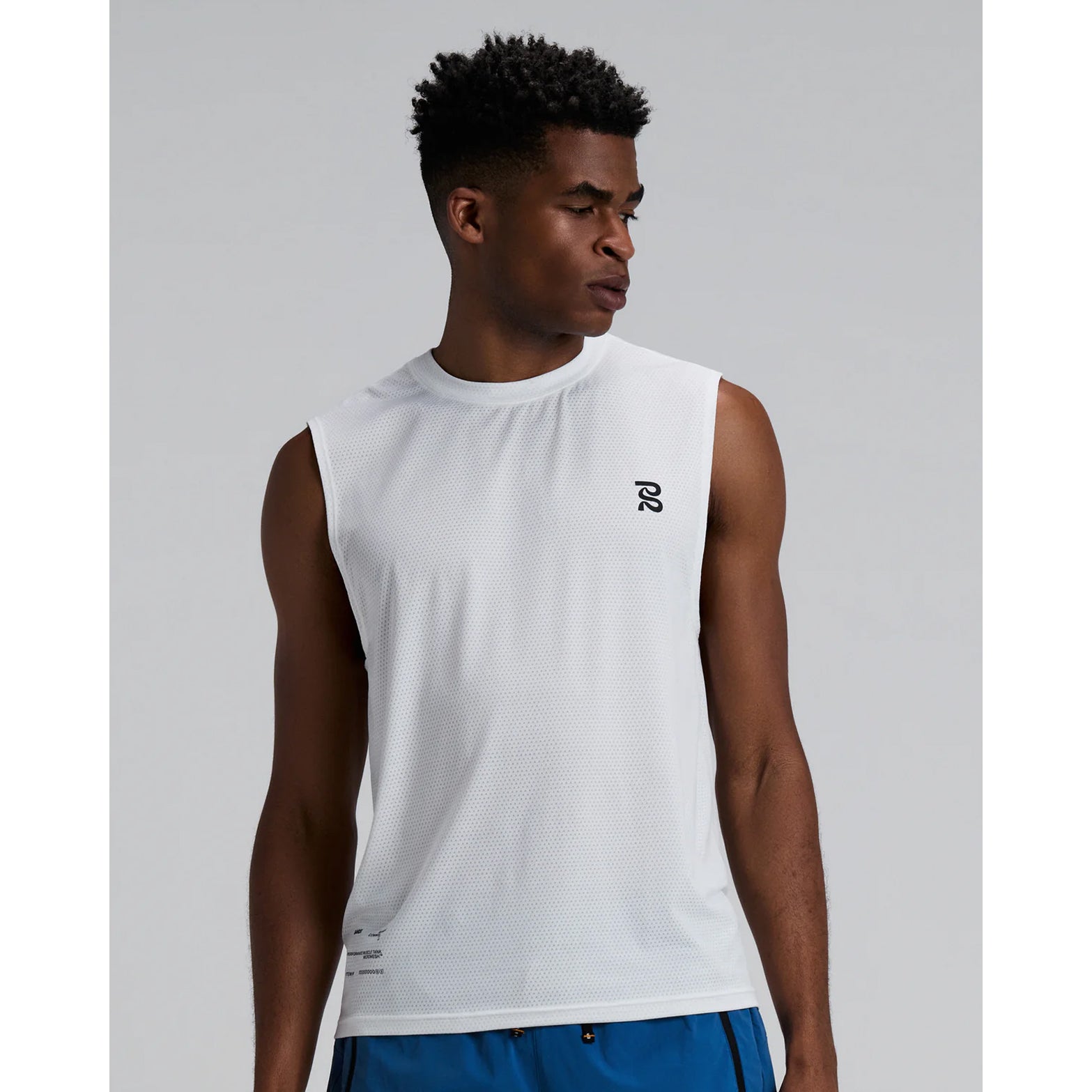 Men's Bandit Micromesh Run Tank White front view on male runner showing comfortable tank fit with breathable Micromesh construction for running and training