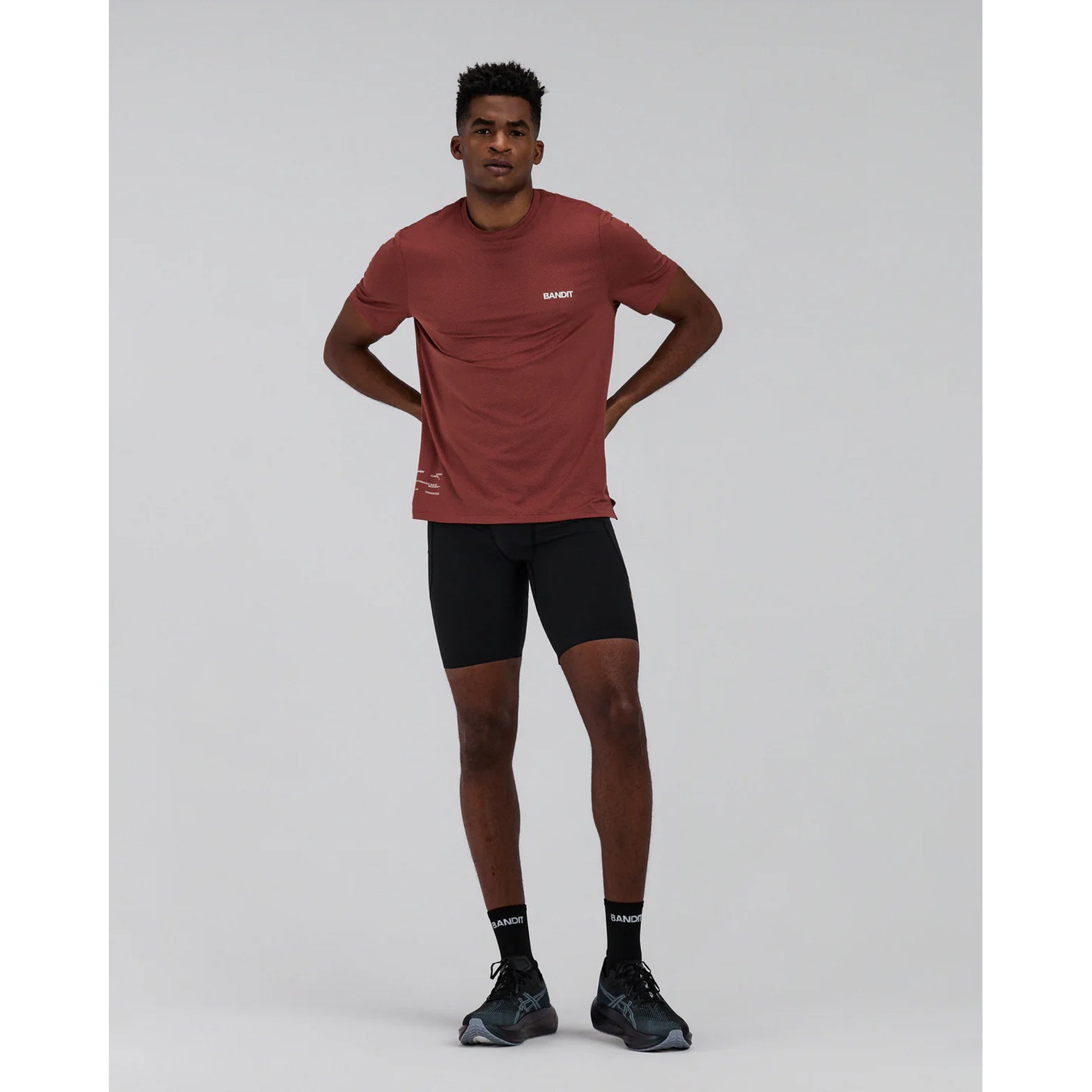 Men's Bandit Micromesh Run Tee Mahogany full body front view on male runner showing relaxed fit with advanced moisture management and reflective details