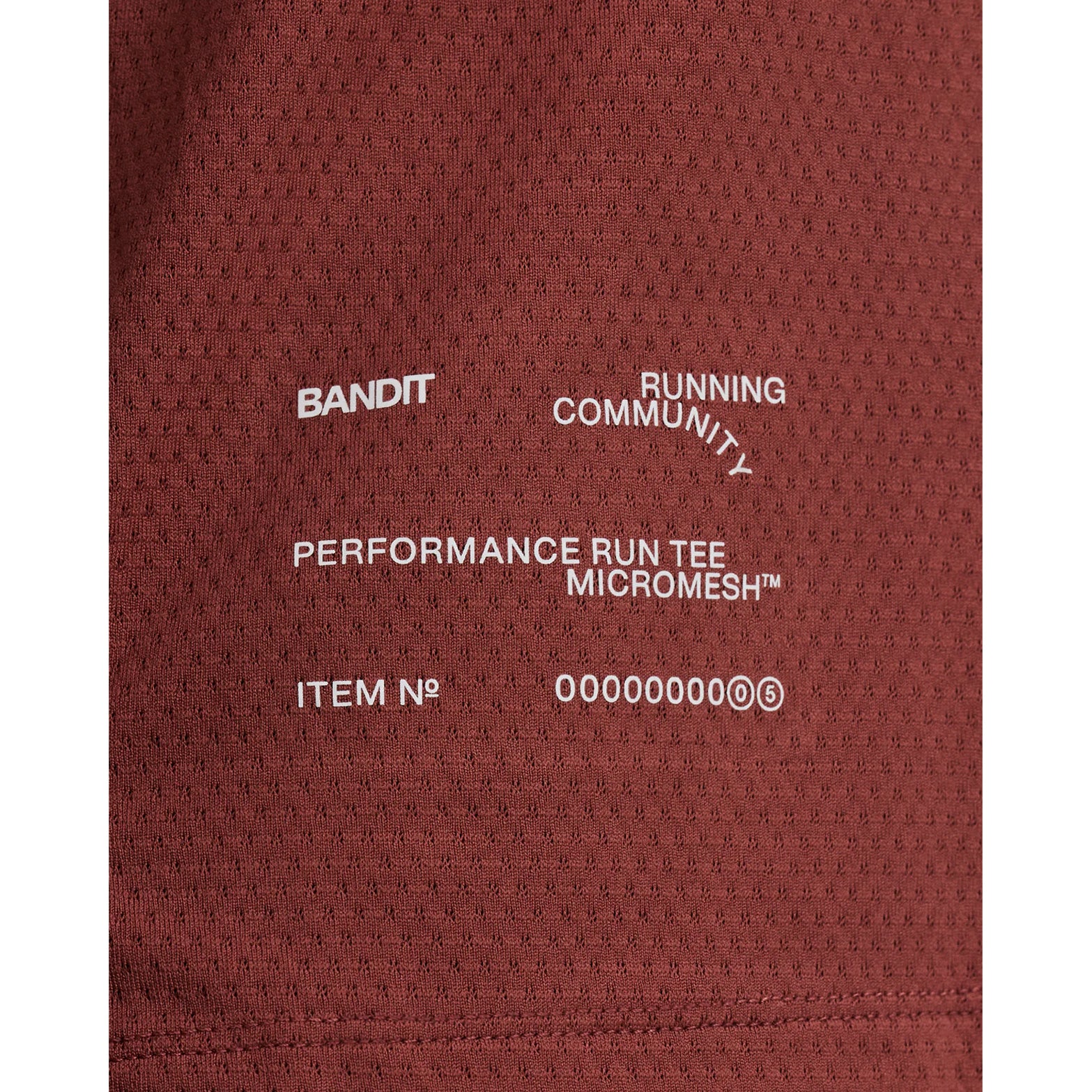 Men's Bandit Micromesh Run Tee Mahogany close-up of reflective graphics at centre front and back plus reflective infographic at front hem for low-light running visibility