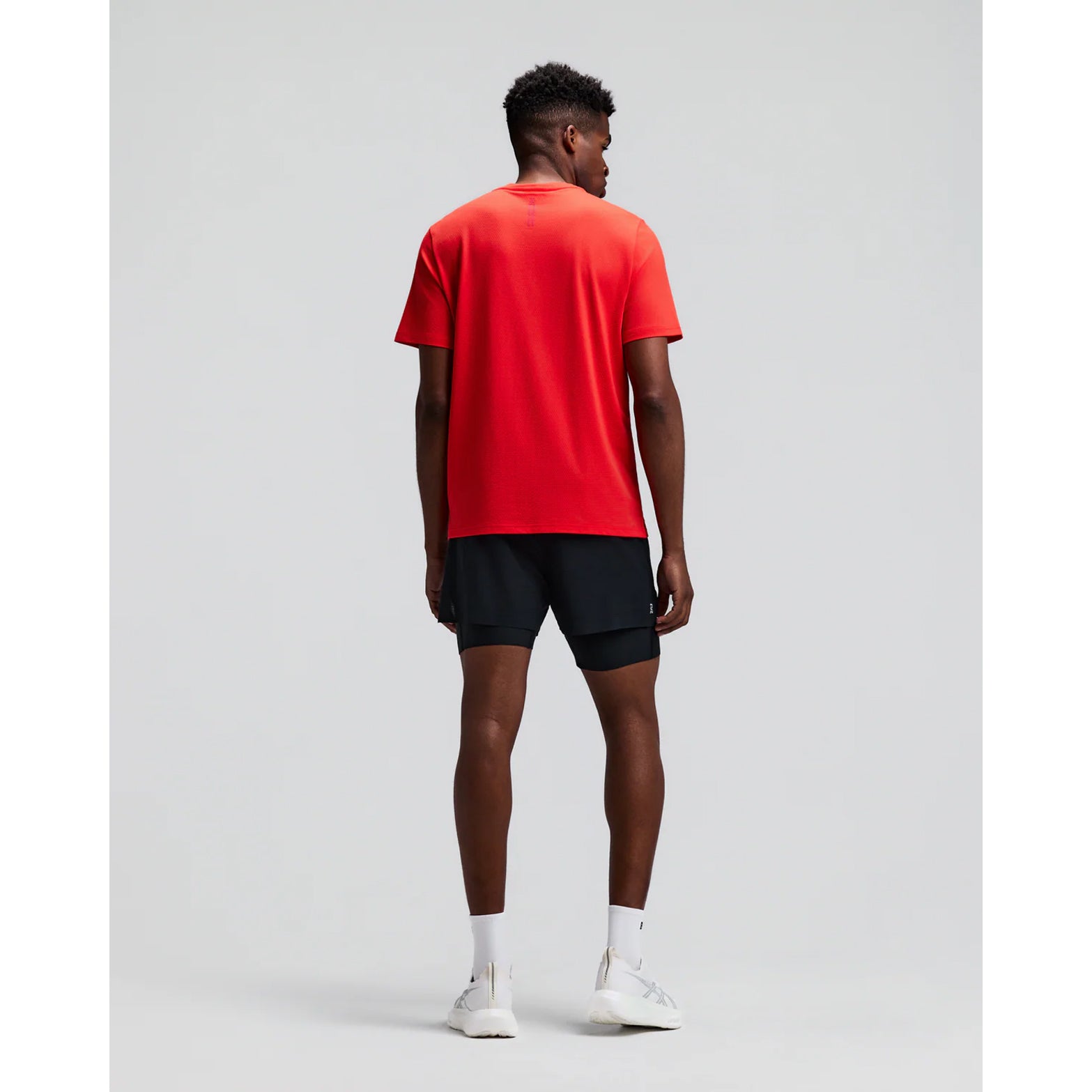 Men's Bandit Micromesh Run Tee Poppy back full body view on male runner showing relaxed fit with fast-drying Micromesh construction for comfortable running and training