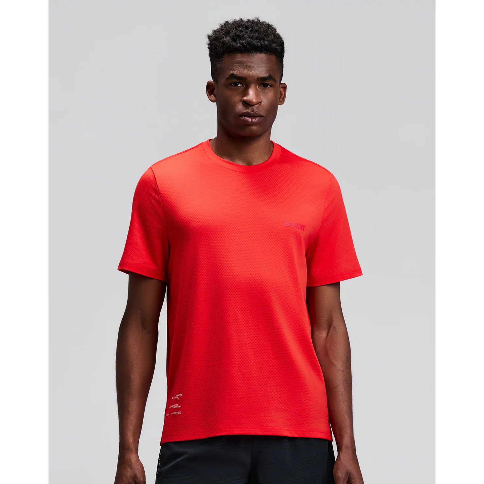 Men's Bandit Micromesh Run Tee Poppy front view on male runner showing comfortable fit with crew neckline and breathable Micromesh construction for running and training