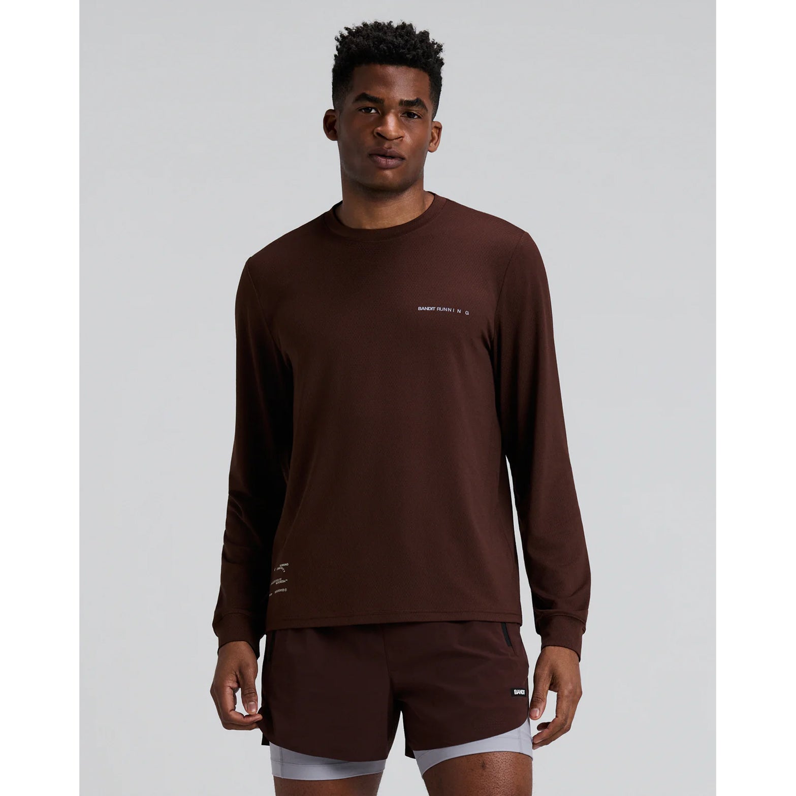Men's Bandit Micromesh Run Top Cacao front view showing relaxed silhouette with sweat-wicking Oeko-Tex Certified mesh and dyed-to-match reflective graphic