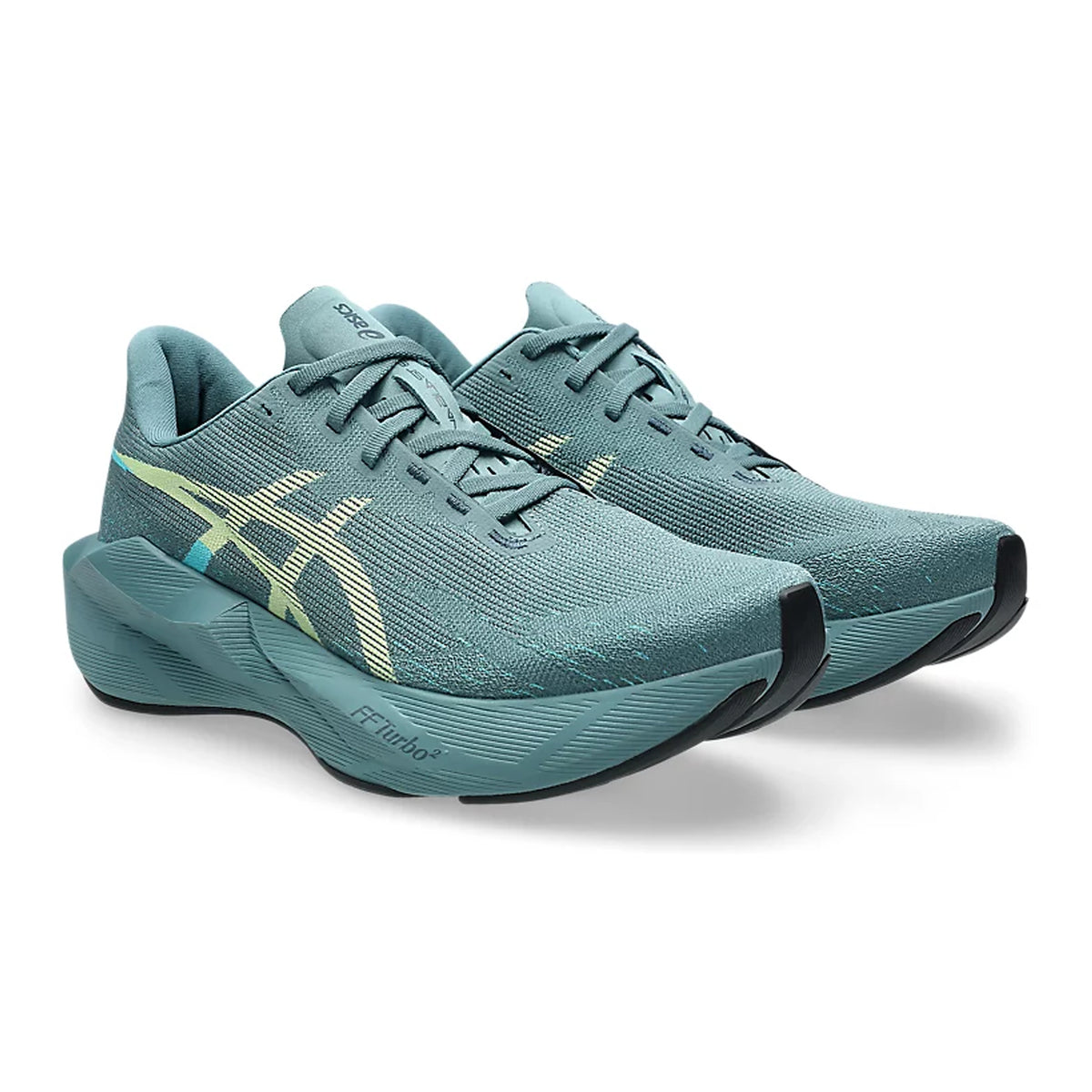 A pair of teal ASICS running shoes with light yellow accents, thick cushioned soles, and mesh uppers, displayed side by side against a white background.