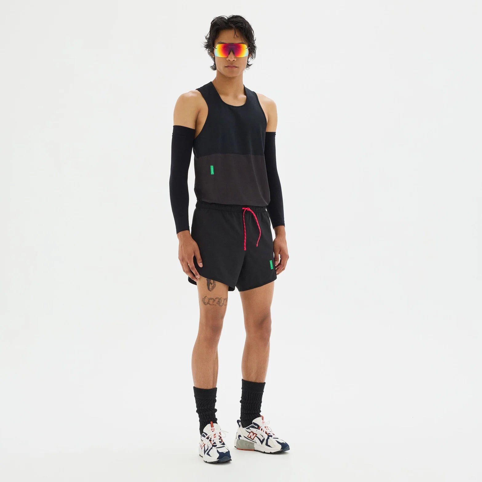 District Vision Men's Paneled Training Singlet Black full body view on male runner showing breathable panel design with lightweight construction for racing and tempo runs