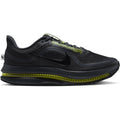A side-profile view of the Nike Men’s Pegasus Premium Running Shoes in Dark Shadow/Black/Yellow Venom, featuring a breathable mesh upper, striking yellow accents, and a visible air-cushioned sole with triple-layer cushioning designed for enhanced energy return.