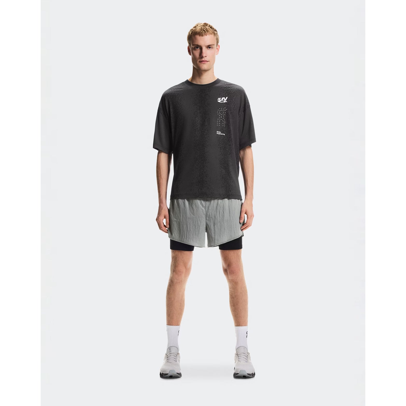 Men's On Performance Volt-T Iron full body front view on male runner showing relaxed fit with On DryTec moisture-wicking for running, training and post-workout wear
