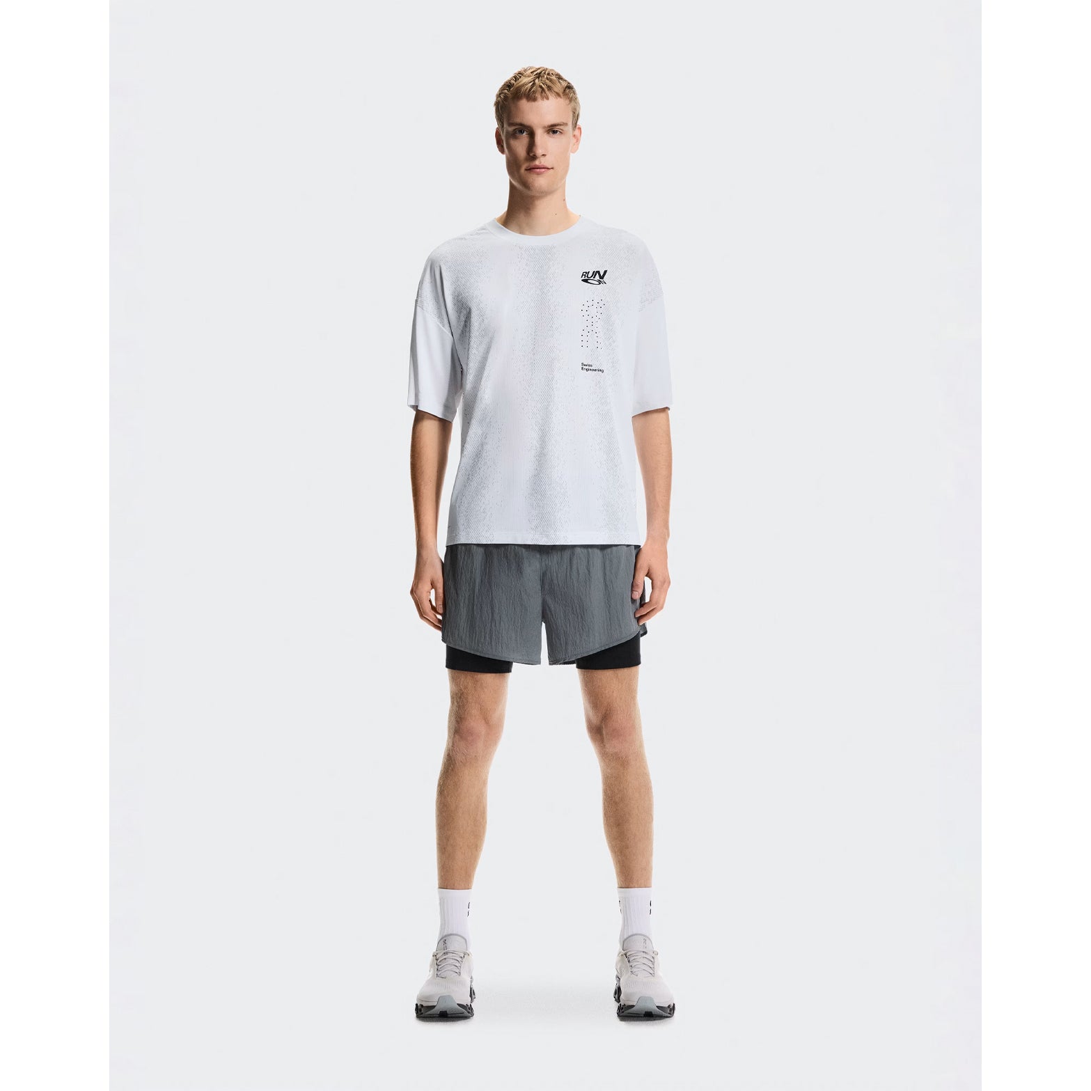 Men's On Performance Volt-T White full body front view on male runner showing relaxed fit with On DryTec moisture-wicking for running, training and post-workout wear
