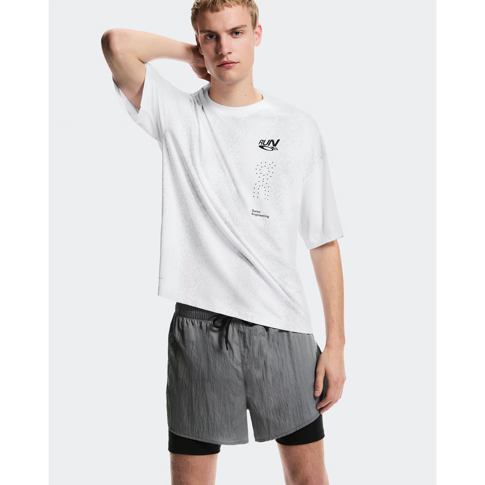 Men's On Performance Volt Shorts Glacier front view on male runner showing lightweight iridescent outer fabric with moisture-wicking On DryTec inner layer