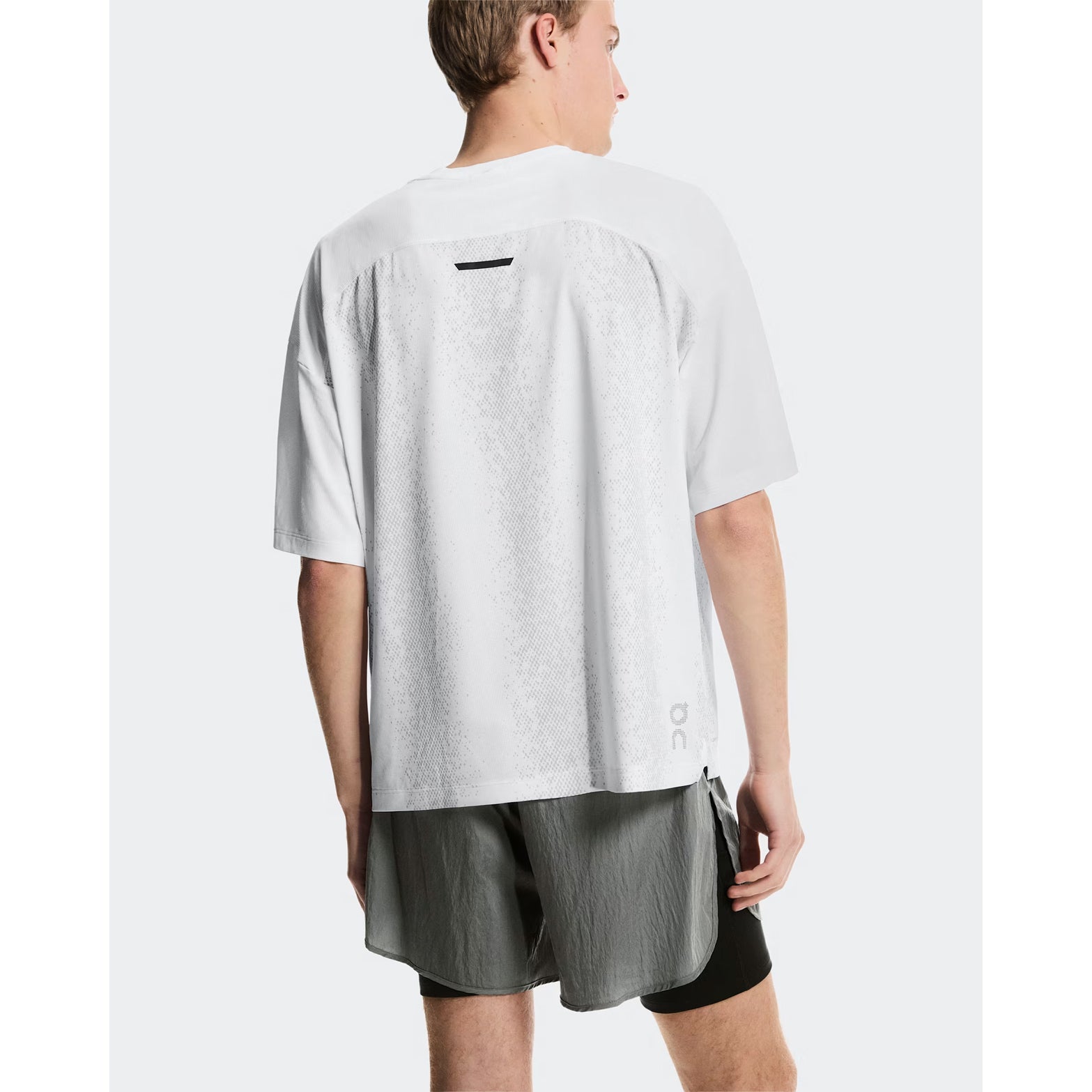 Men's On Performance Volt Shorts Glacier back view on male runner showing additional back pocket for storage and windproof water-repellent outer construction
