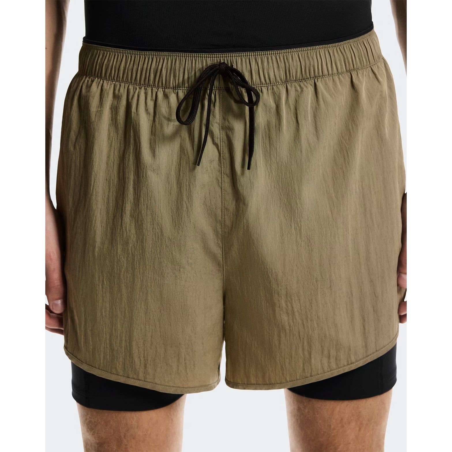 Men's On Performance Volt Shorts Safari close-up front showing iridescent fabric outer with inner pockets and four-way stretch supportive tights