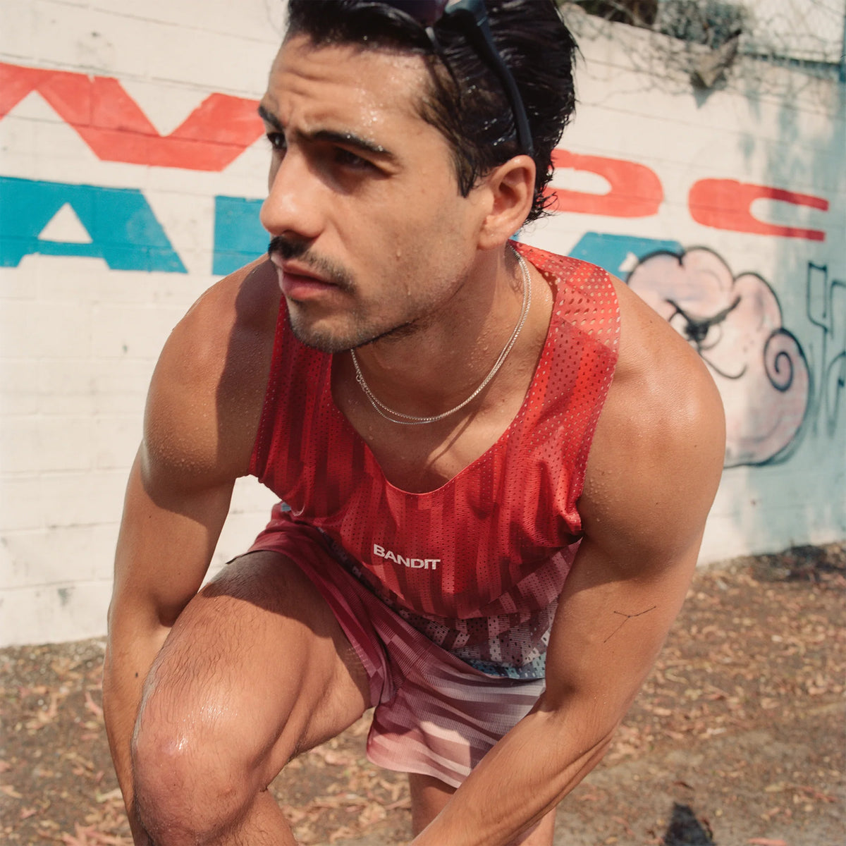 Men's Bandit Shredder Shorty Race Singlet Uneven Gradient Poppy close-up of front showing Shredder gradient mesh with bonded seams and two-tone reflective Bandit branding