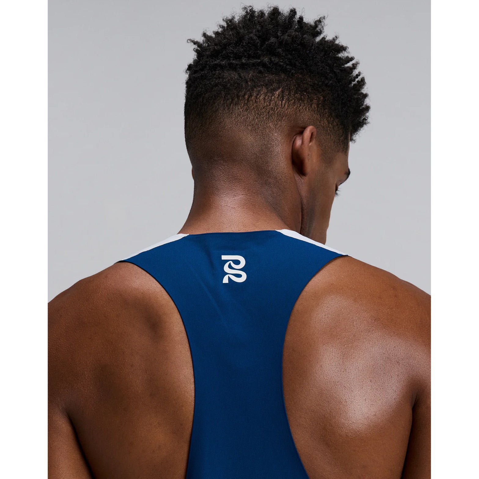 Bandit Specter Race Singlet men's in Undertow Ink Blue Multi — closeup of back showing deep racerback construction, Acrofuse™ bonded seam detail and undertow ink blue multi Specter™ performance fabric