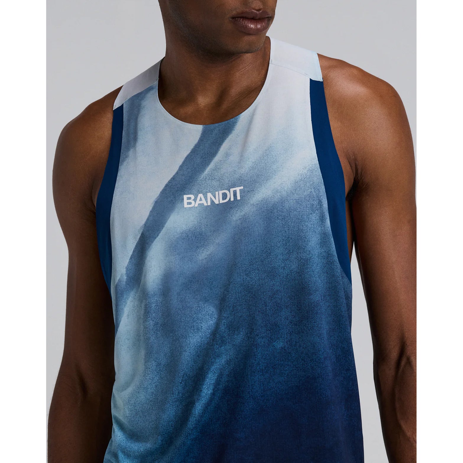 Bandit Specter Race Singlet men's in Undertow Ink Blue Multi — closeup of front showing narrow strap construction, Acrofuse™ bonded seam detail and undertow ink blue multi Specter™ performance fabric