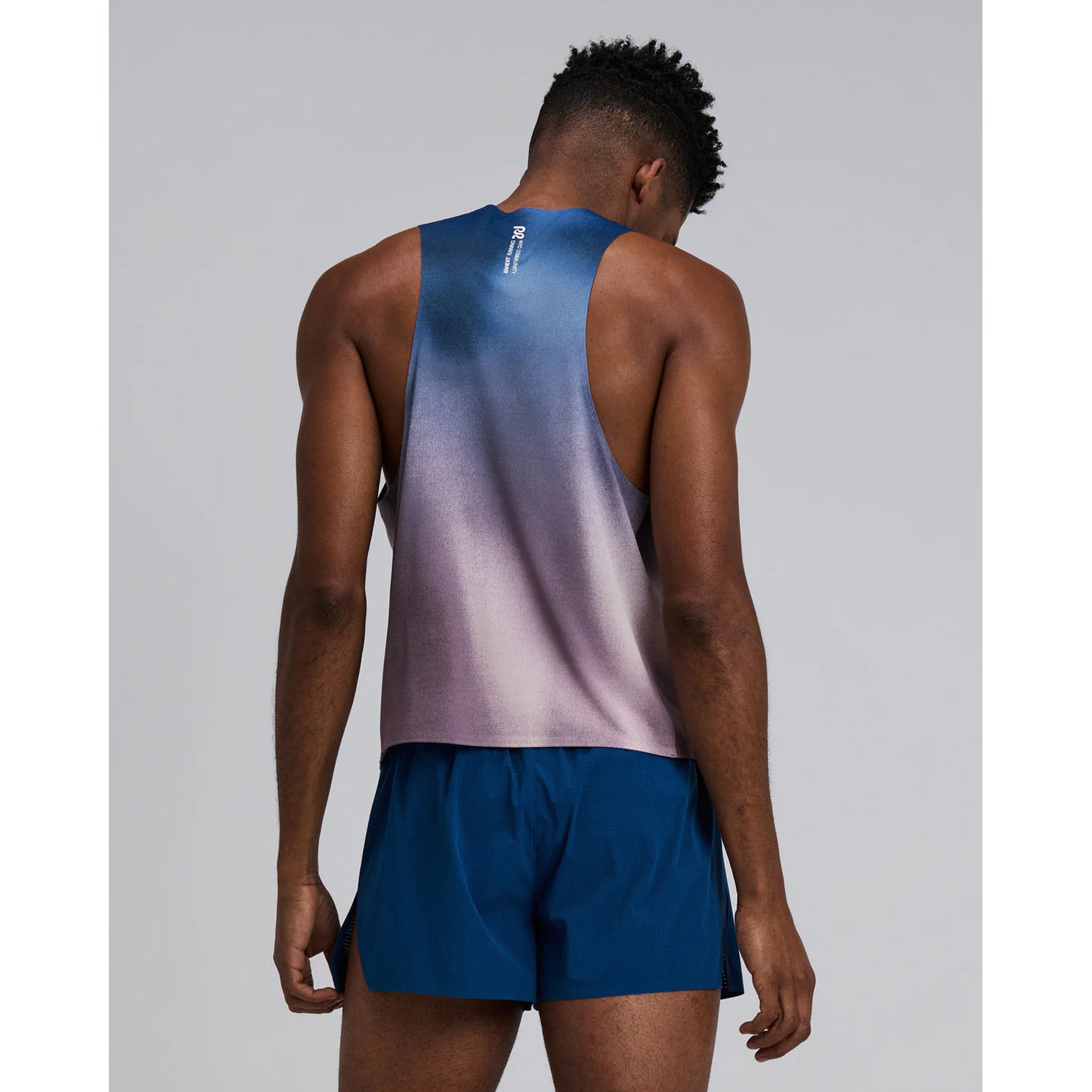 Bandit Specter Shorty Race Singlet men's in Flow State Aegean Multi — back view worn on model showing deep racerback fit, Acrofuse™ bonded seam construction, side slits and flow state aegean multi Specter™ fabric