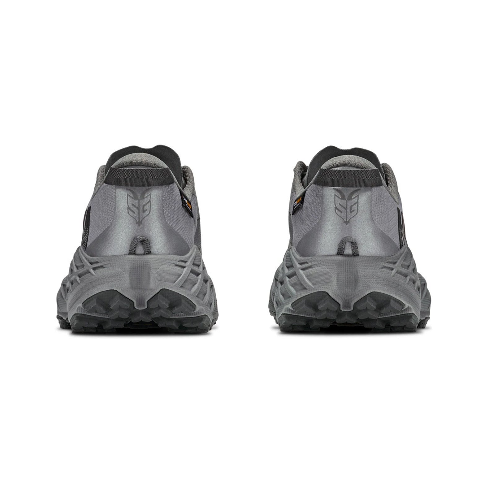 A pair of Hoka Men’s Speedgoat 7 GORE-TEX Trail Running Shoes in Asteroid/Galactic Grey is shown from the back on a white background, highlighting the rugged soles and the Hoka logo on each heel.