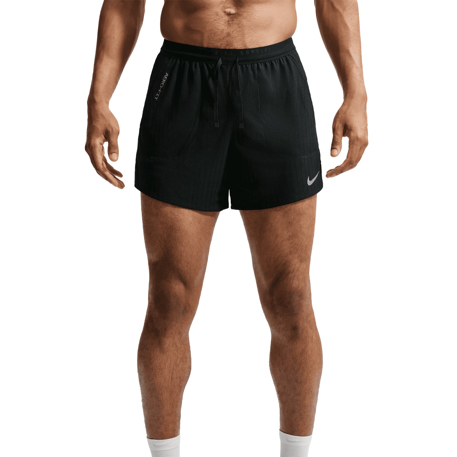 Men's Nike Stride Aero-FIT 5 Inch Shorts Black front view on male runner showing Aero-FIT jacquard knit with side pockets and elastic waistband for breathable comfortable daily training