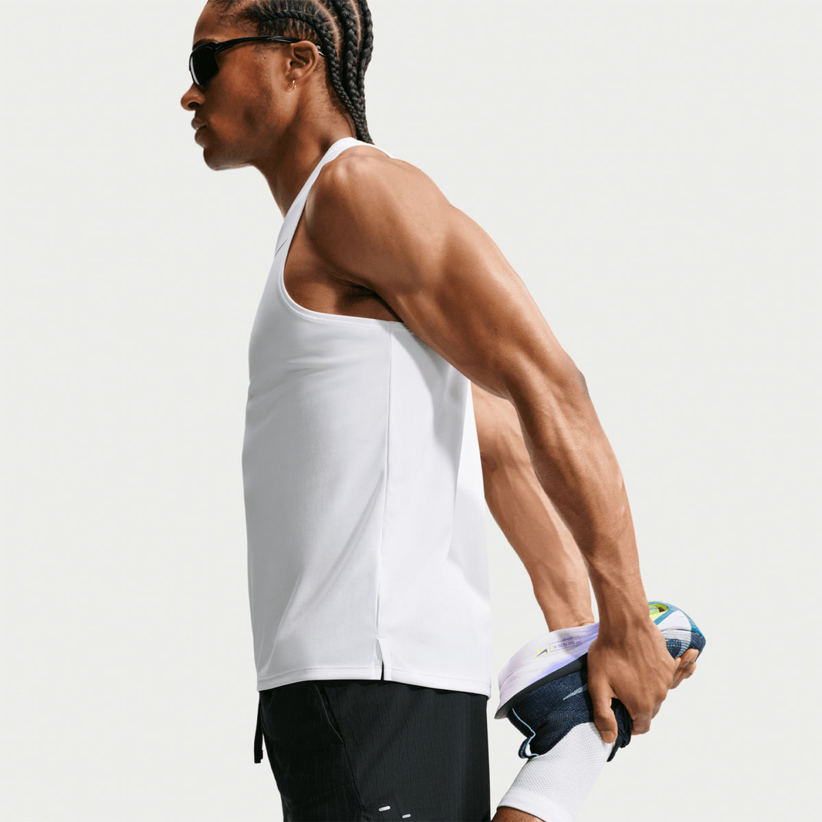 Men's Nike Stride Aero-FIT 5 Inch Shorts Black side view on male runner showing 5-inch inseam with Aero-FIT jacquard knit and side pocket for accessible storage during running