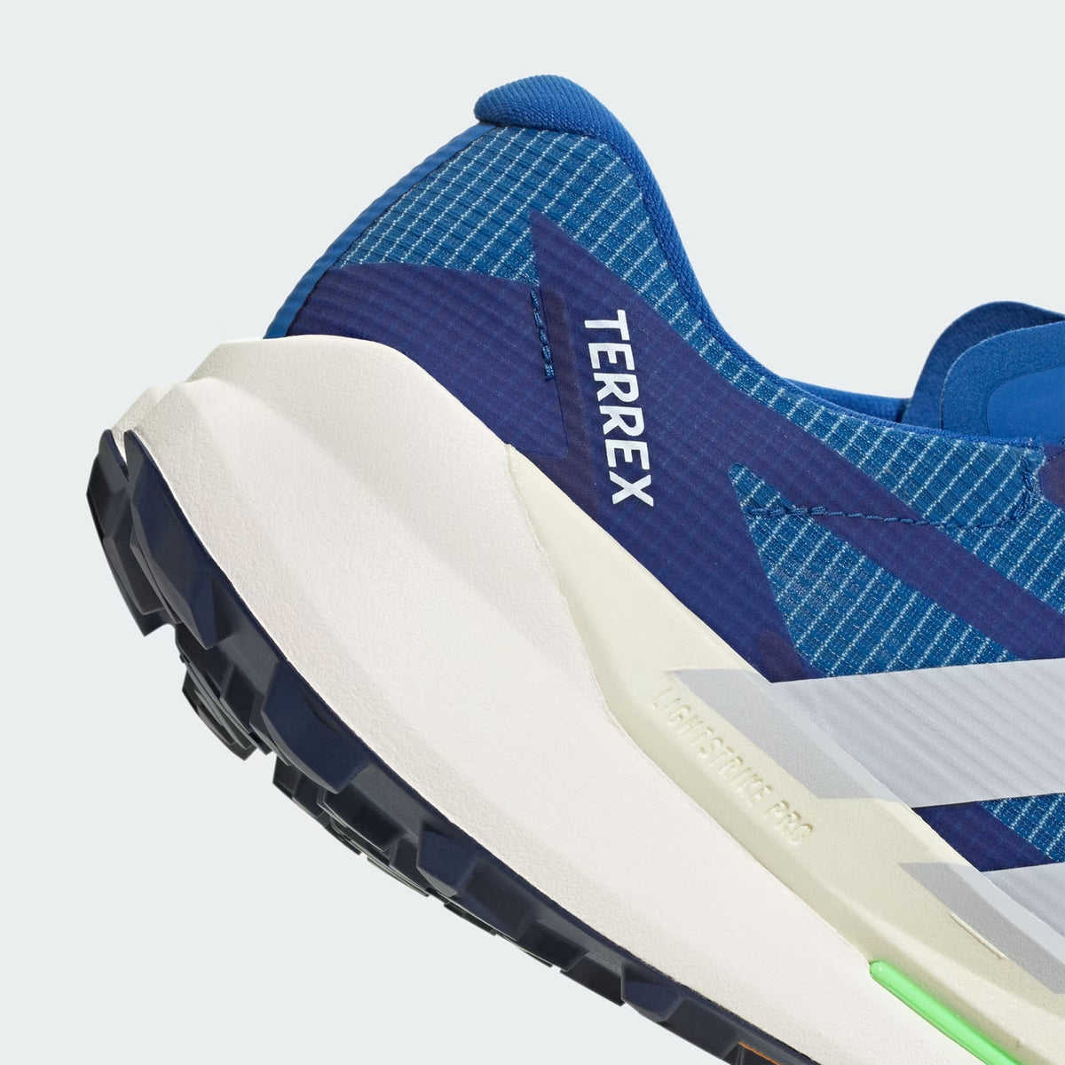 Men's adidas Terrex Agravic TT Trail Running Shoes Blue Dash Grey Lime Burst angled side and heel view showing LIGHTSTRIKE PRO responsive cushioning with durable reinforced mesh and trail-gripping outsole for fast racing on technical rocky terrain