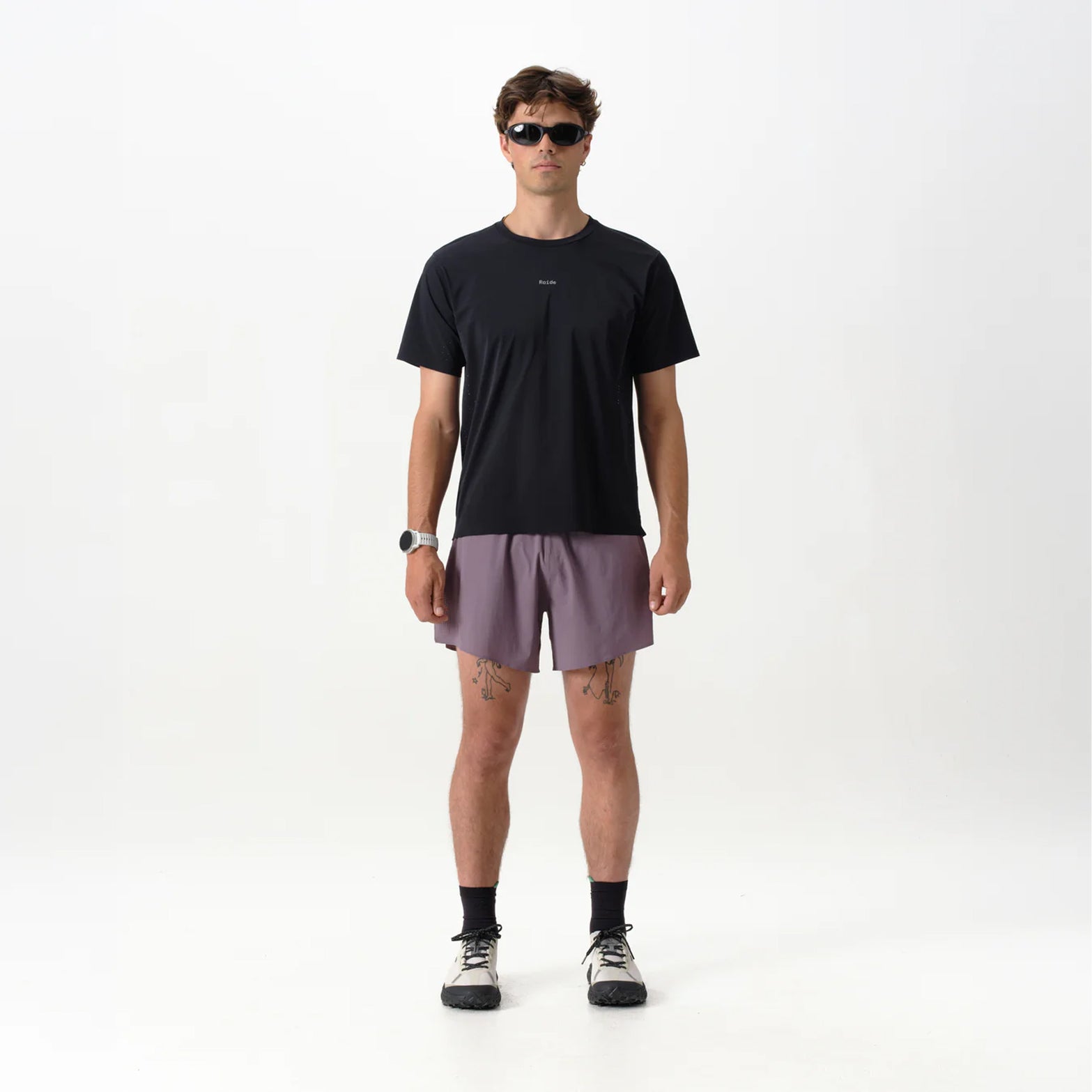 Men's Raide Thermal Dispersion Tee Black front full body view on male runner showing cool-to-touch Italian microfibre with four-way stretch and body-mapped perforations for lightweight warm weather training