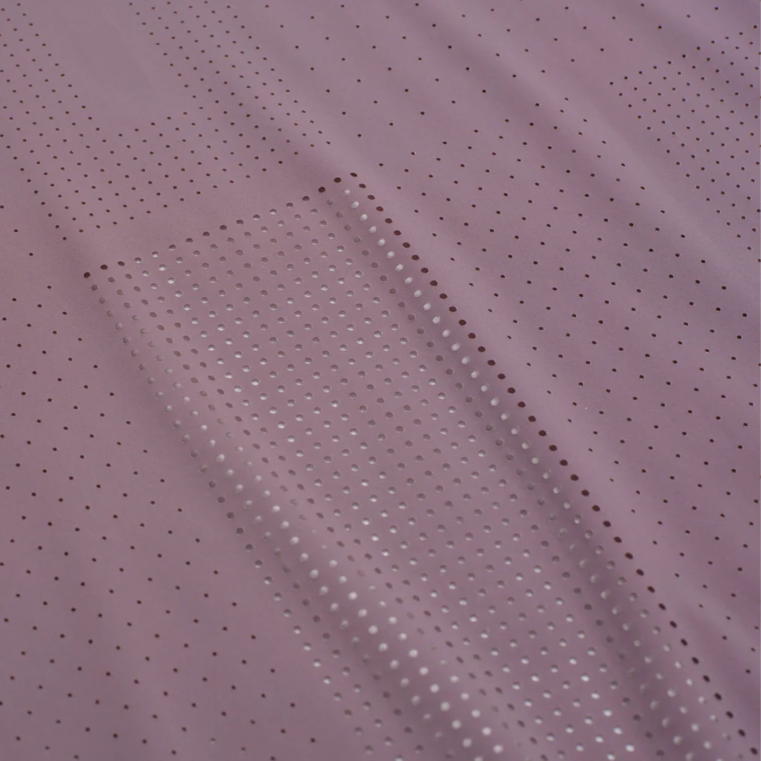 Men's Raide Thermal Dispersion Tee Dusk close-up of body-mapped laser-cut perforations showing concentrated centre back ventilation zones with 115gsm Italian-knit microfibre for maximum evaporative cooling