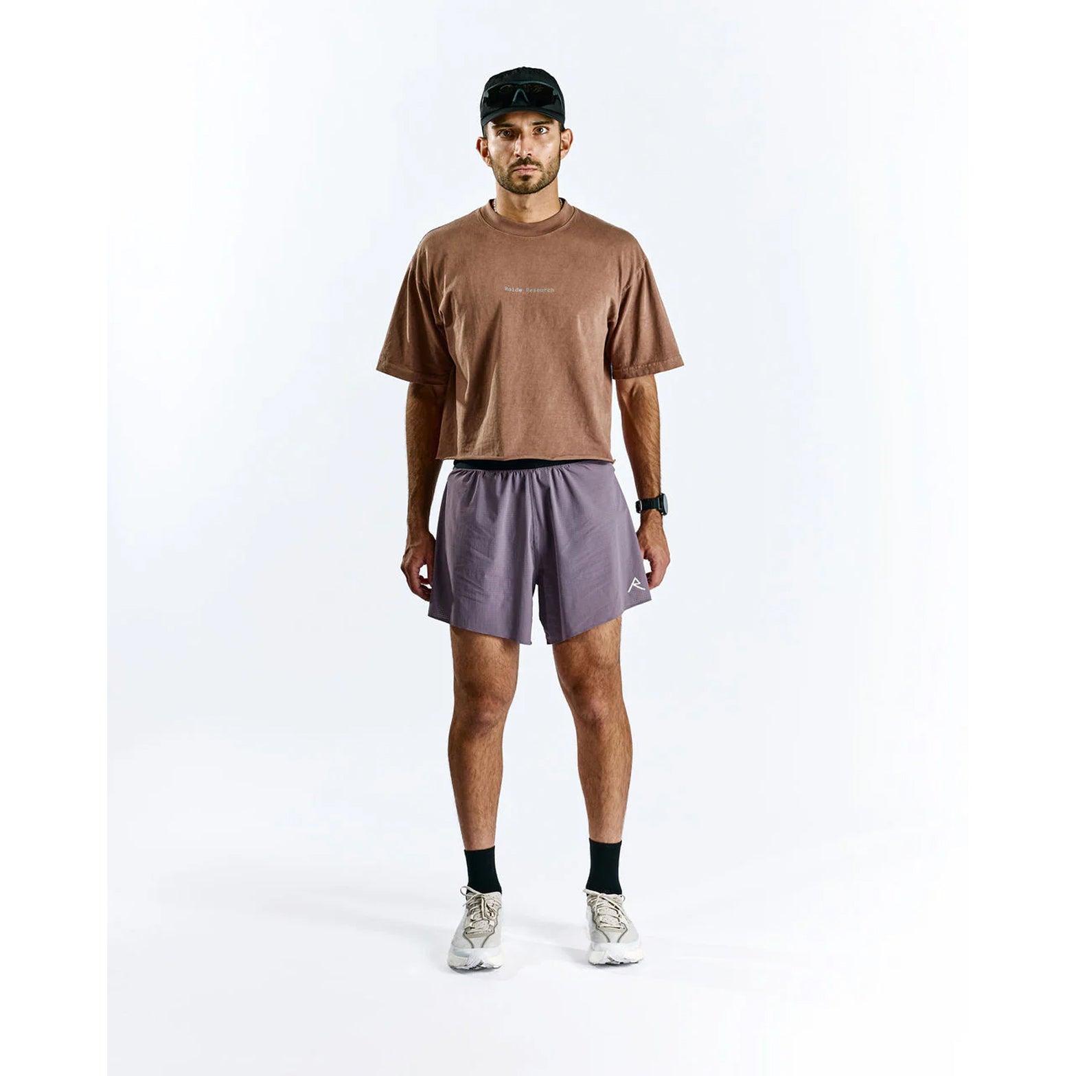 Raide TrailTech Short men's in Dusk — full body front view worn on model showing 5.25 inch silhouette, laser-perforated waistband and pocket placement in motion on trail