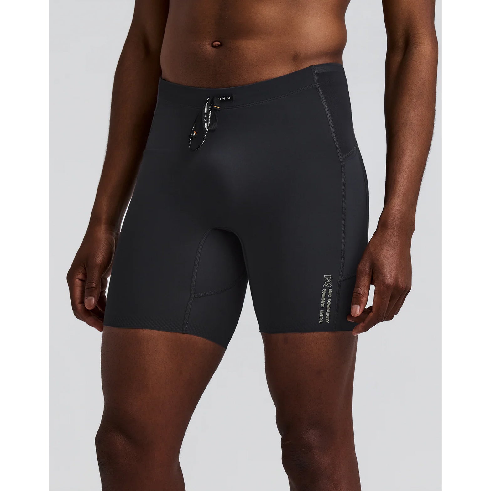 Men's Bandit Vanisher Quarter Tights Anthracite front view on male runner showing Vanisher sweat-hiding compression with GripDot laser-cut hems and custom drawstring waistband for race day performance