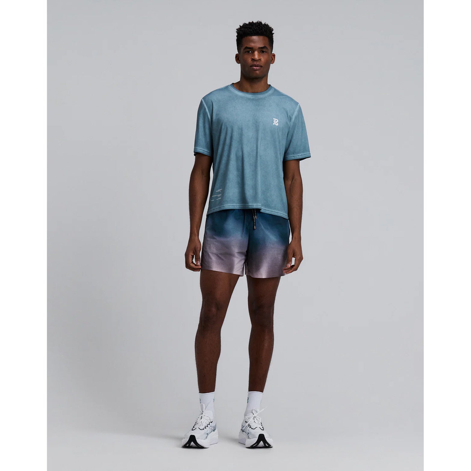 Bandit Vento™ 5 Inch Run Shorts men's in Flow State Aegean Multi — full body front view worn on model showing 5 inch silhouette, flow state aegean multi Vento™ four-way stretch fabric and custom branded drawstring waistband in motion
